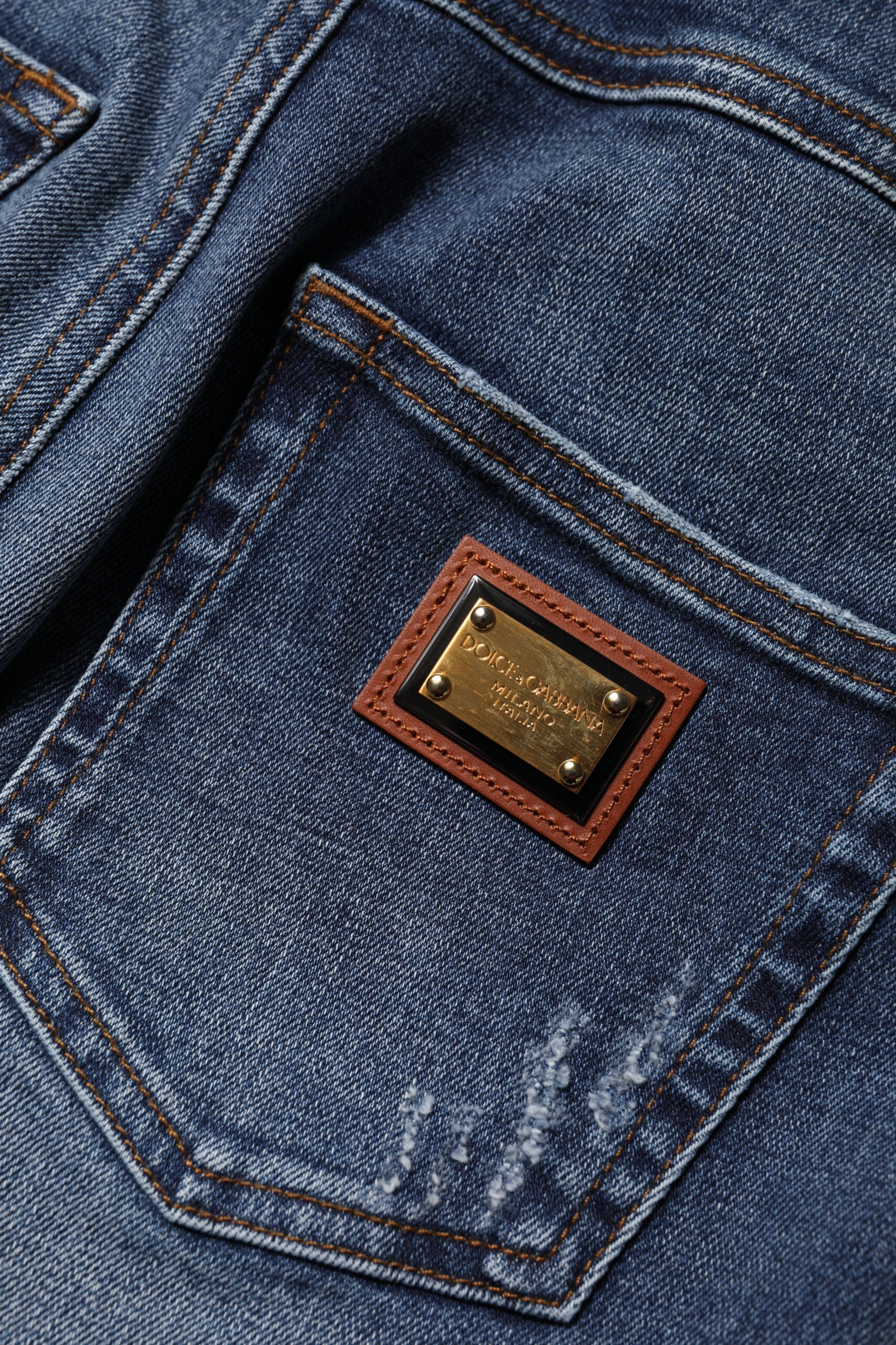 Blue jeans with a brown label on the back pocket