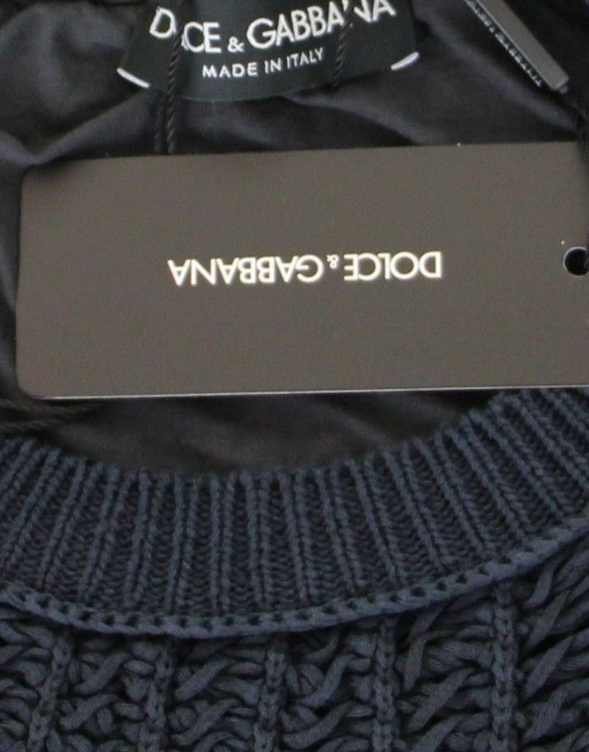 Black sweater with tag on neck