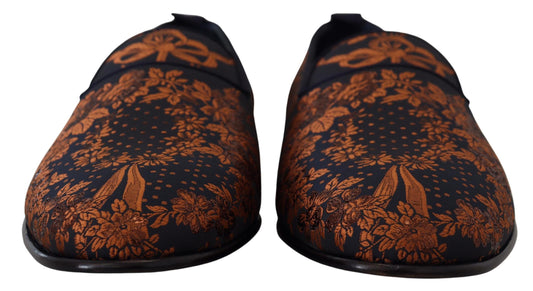 Pair of black and orange shoes with floral pattern