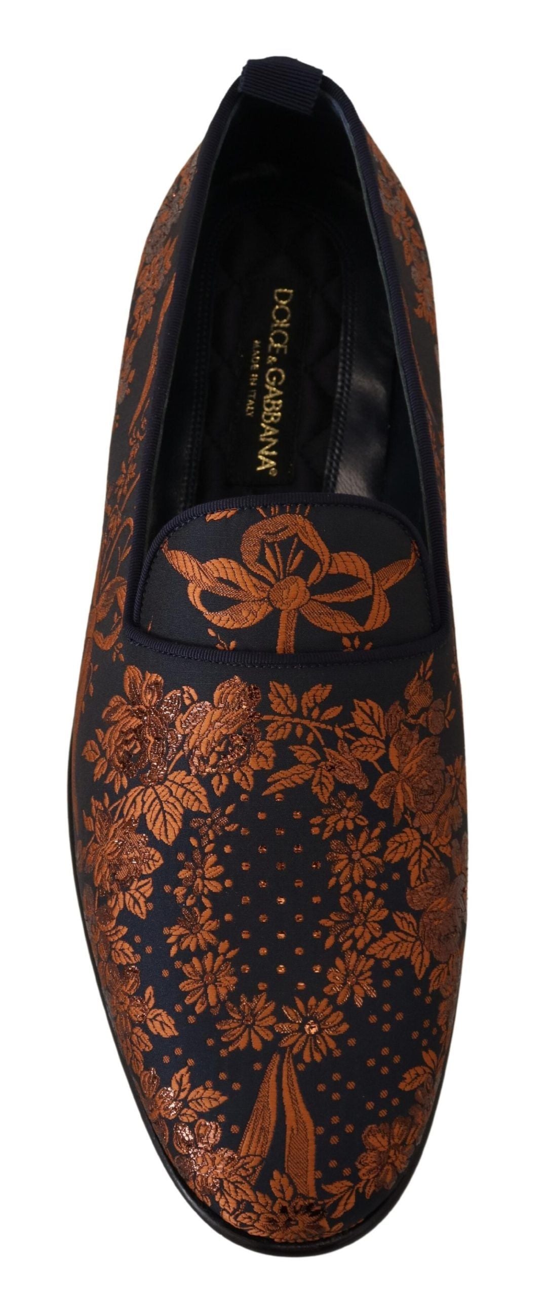 Pair of men's shoes with patterned design on top and plain black sole