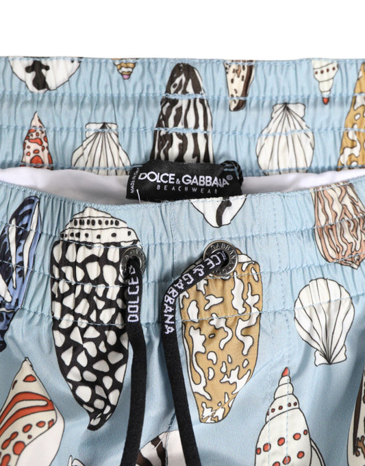 Blue swim trunks with shells on them