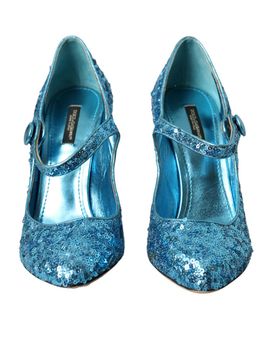 Pair of blue glittery women's shoes with strap and bow detailing