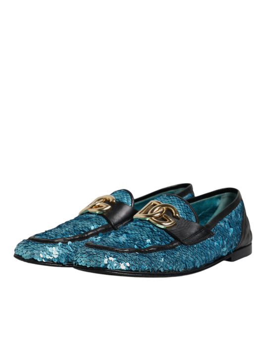 A pair of blue sequined loafers with gold buckles, part of the formal dress shoe collection by Dolce & Gabbana