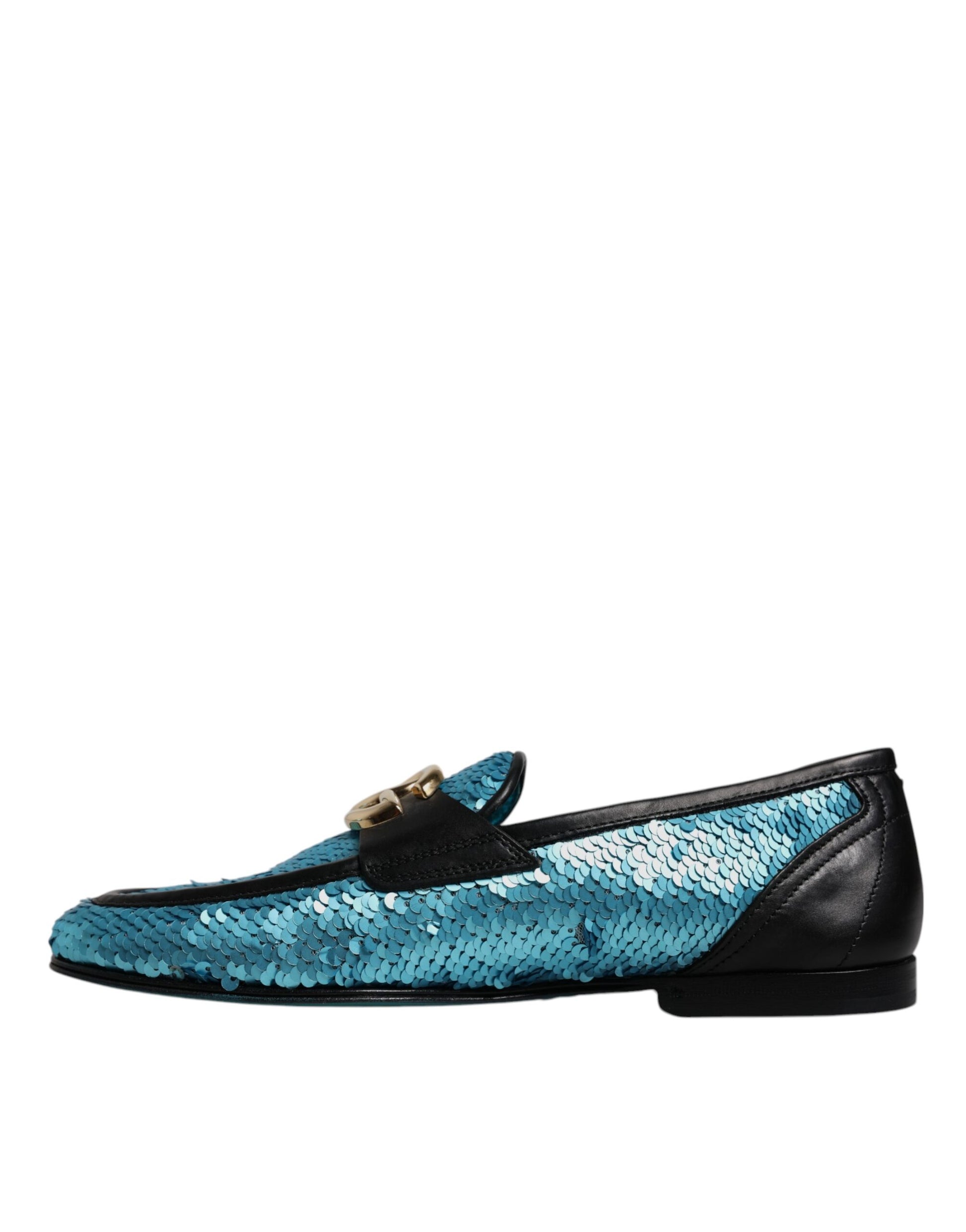 A pair of blue sequined loafers with a gold buckle, designed by Dolce & Gabbana