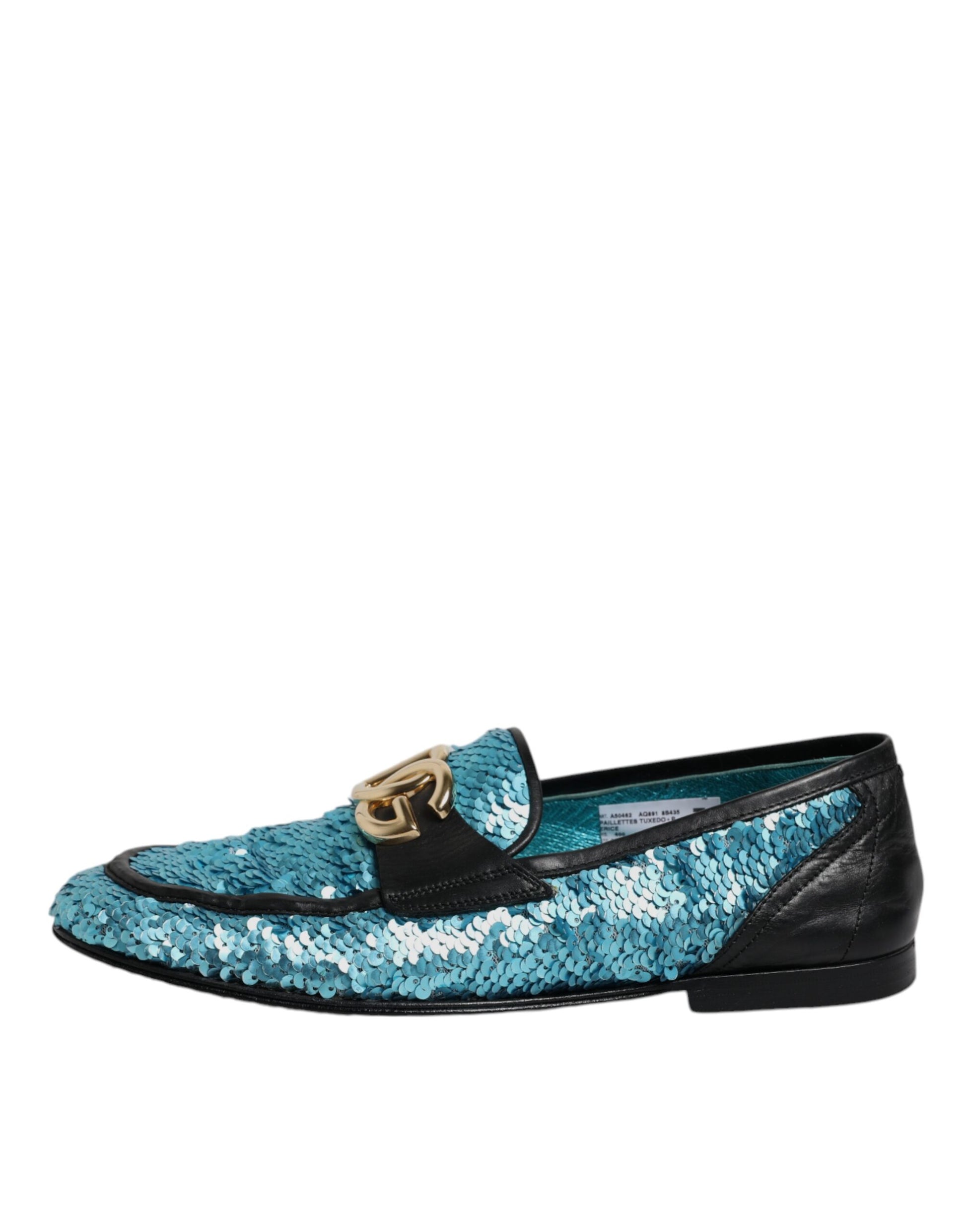 A pair of blue sequin loafers with a gold buckle, designed by Dolce & Gabbana