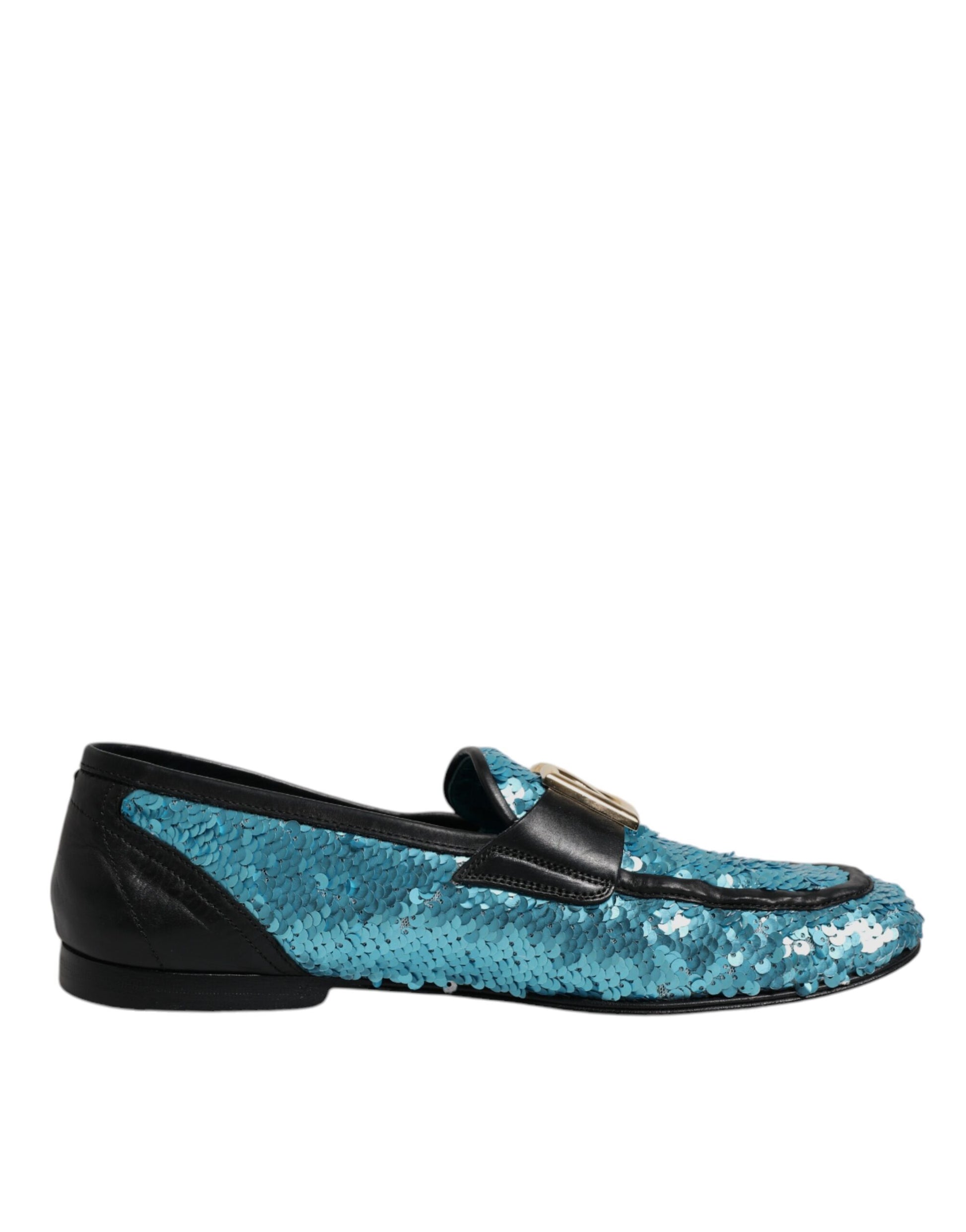 A pair of blue sequined loafers with a gold buckle, designed by Dolce & Gabbana
