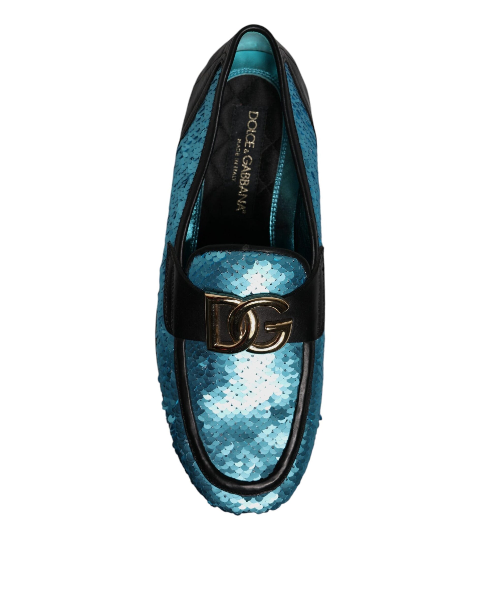 A pair of blue sequined loafers with a gold buckle, designed by Dolce & Gabbana
