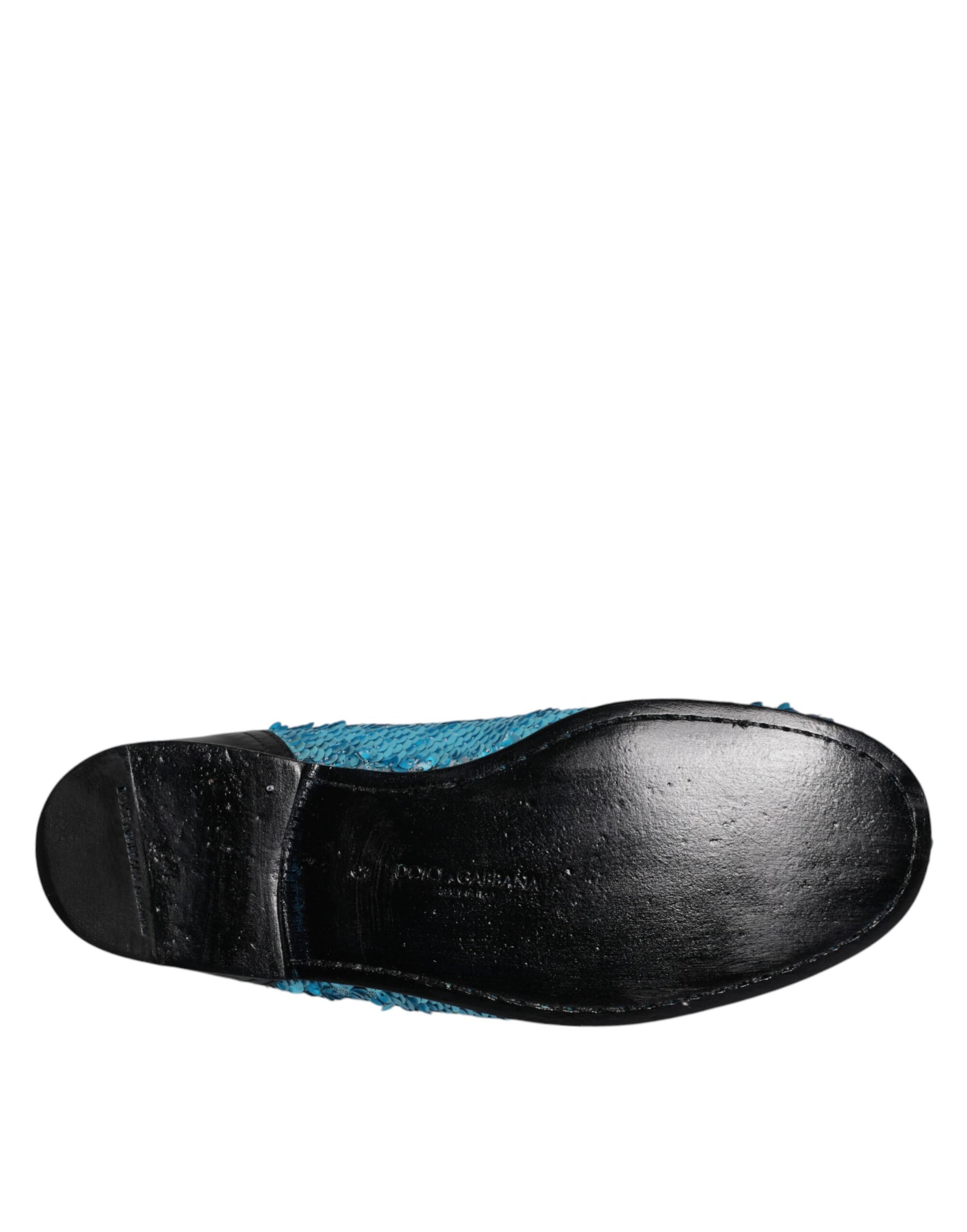 A pair of blue sequined loafers with a black heel, designed by Dolce & Gabbana