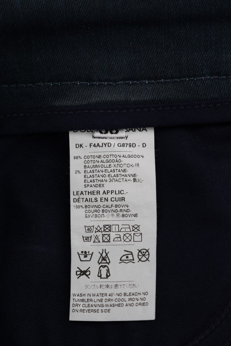 Tag on blue jeans indicating leather application