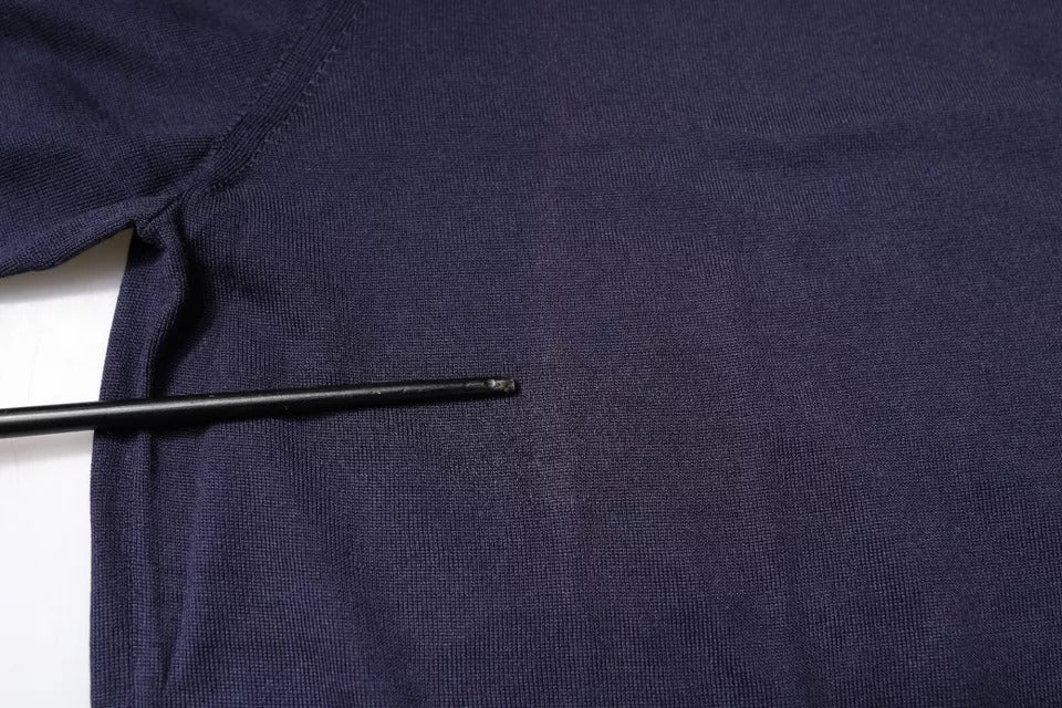 Navy blue sweater with a hole in front