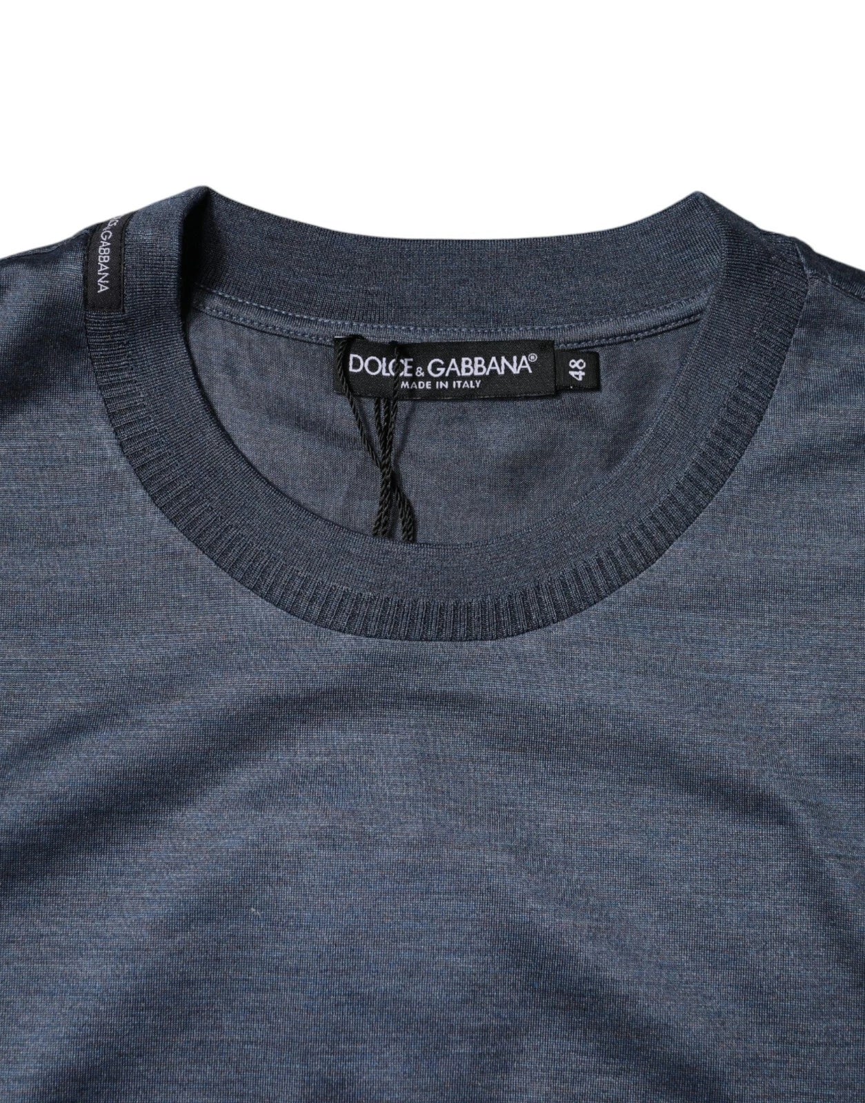 Dark blue crew neck t-shirt with brand label on front