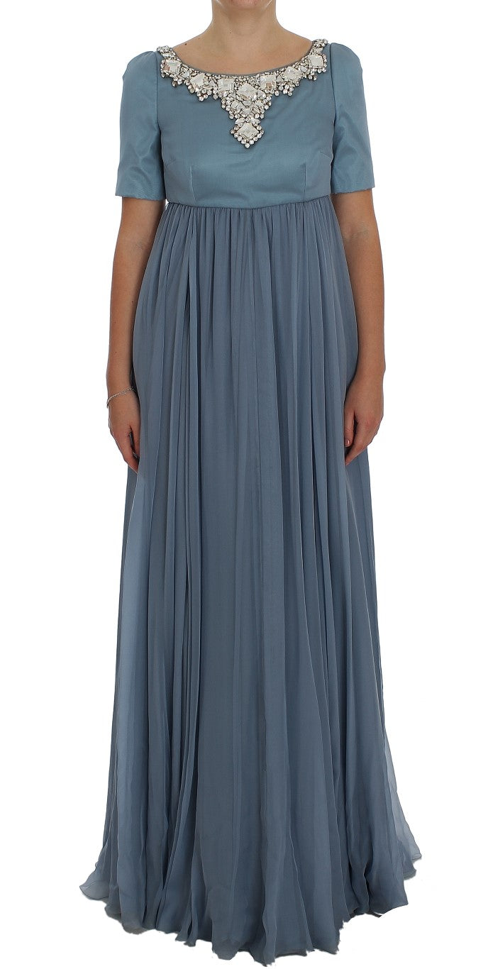 Long blue dress with ruffles on sleeves and hem