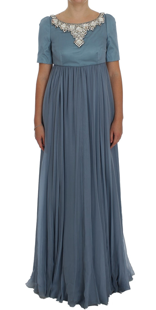 Long blue dress with ruffles on sleeves and hem