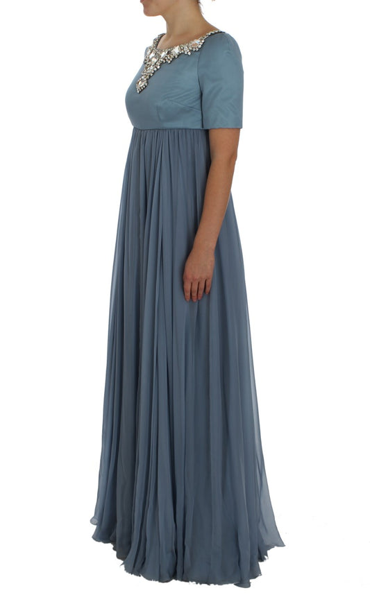 Long blue dress with ruffles on hem