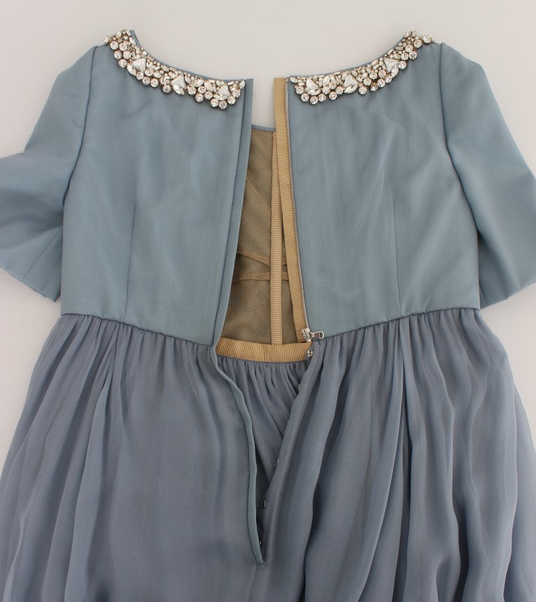 Blue dress with ruffled sleeves and bodice trimmed in gold
