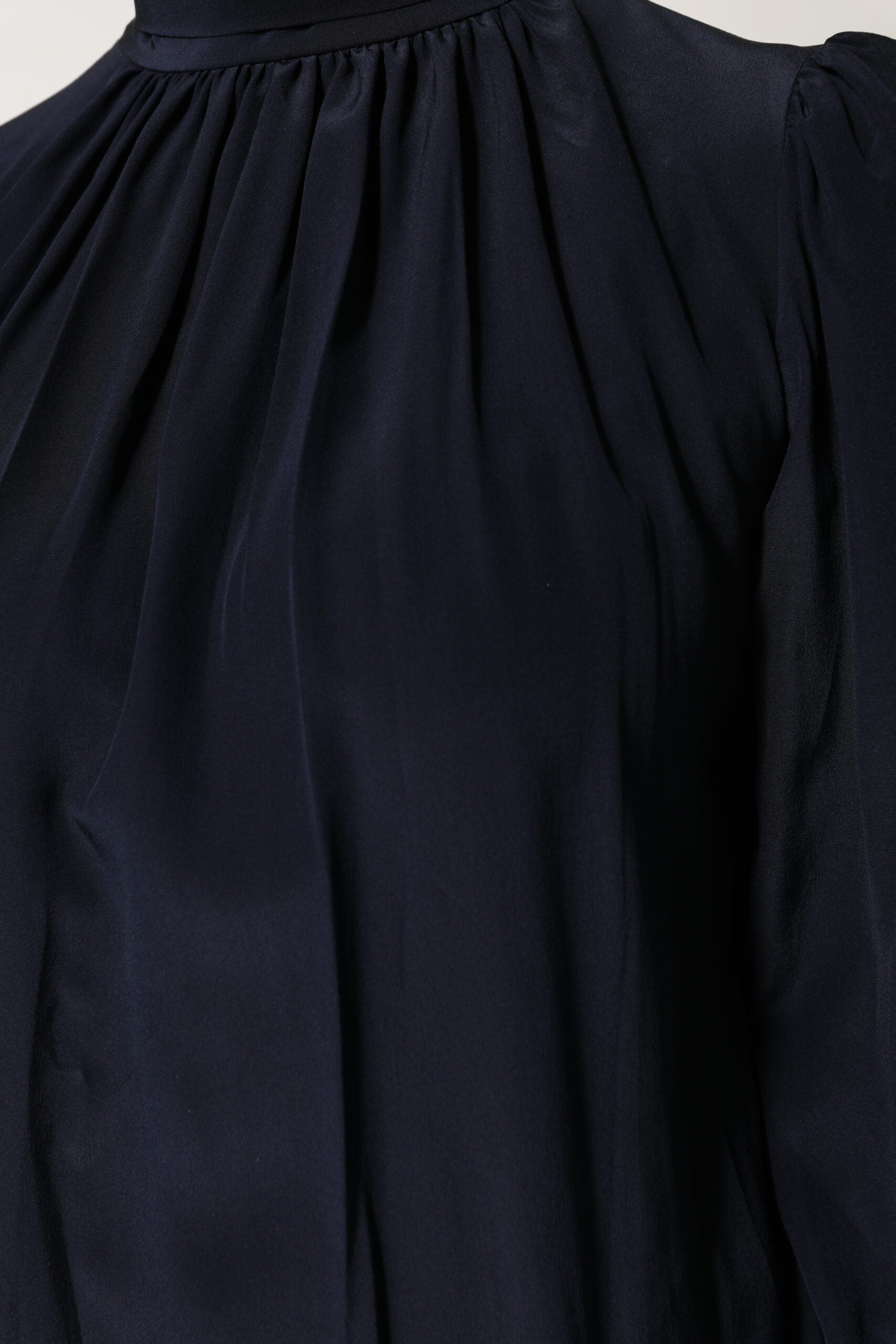 Black long sleeve dress on display