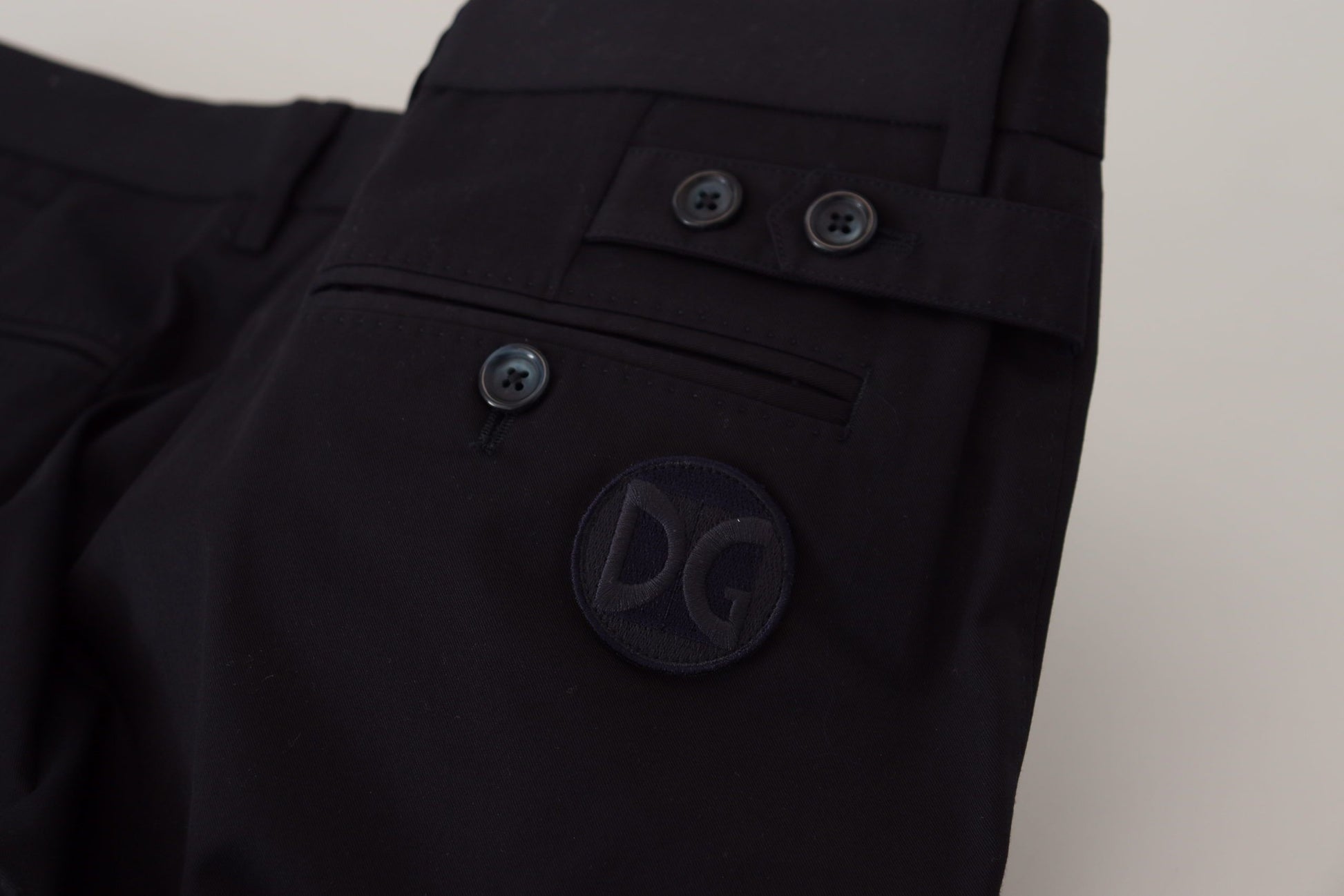 Pair of black pants with buttons on front