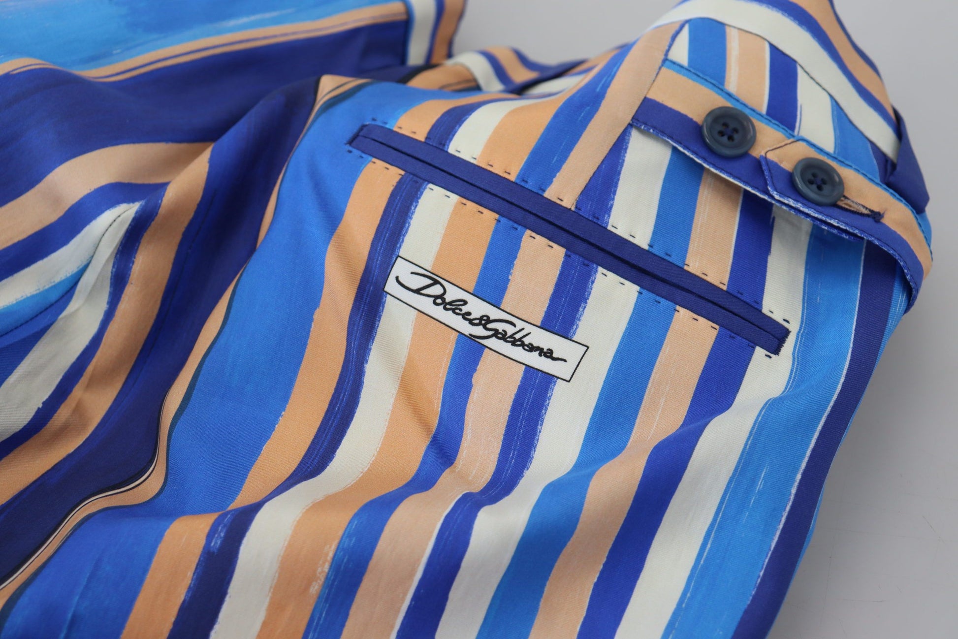 Blue and orange striped fabric with a pocket on the front