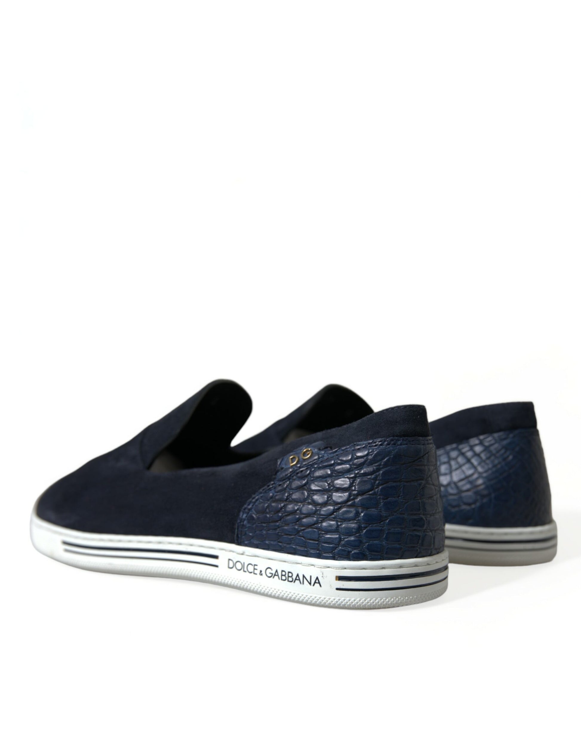 Pair of navy blue sneakers with white soles and a crocodile skin texture on the side