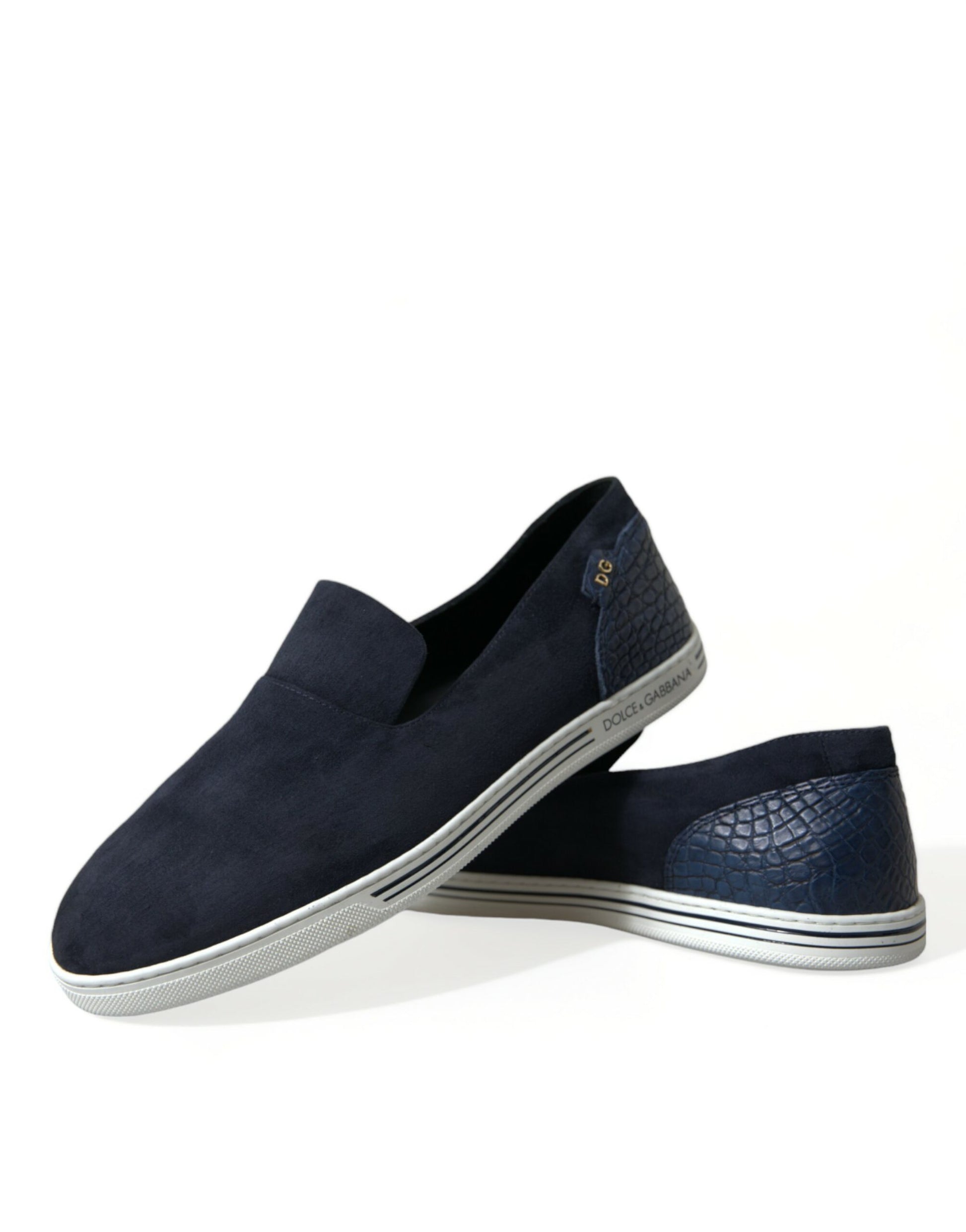 Pair of navy blue loafers with white soles and a small gold emblem on the side