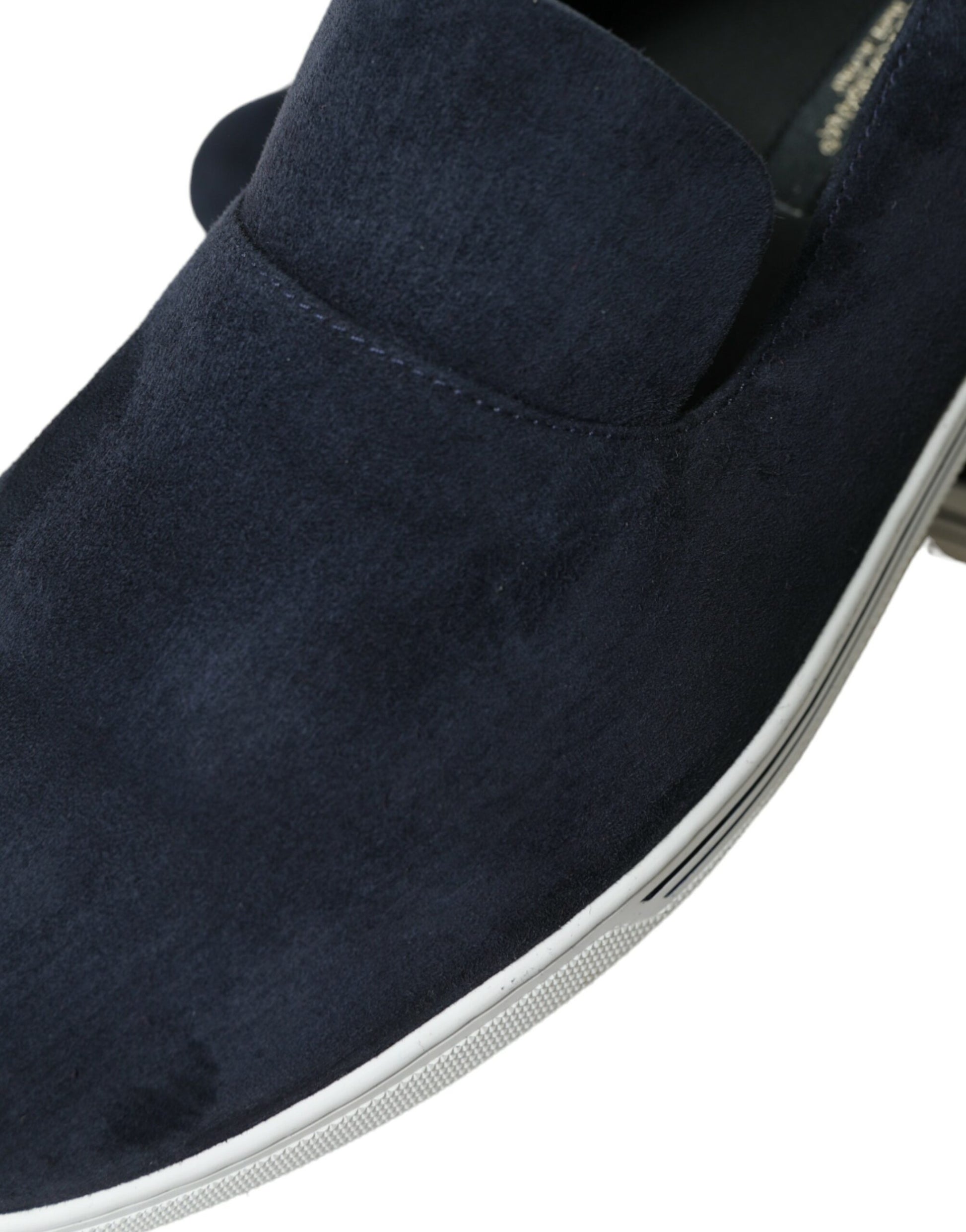 Blue suede loafer with white sole and laces