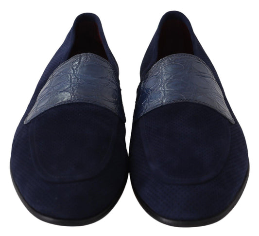 Pair of blue velvet loafers with embossed detailing and elastic panels