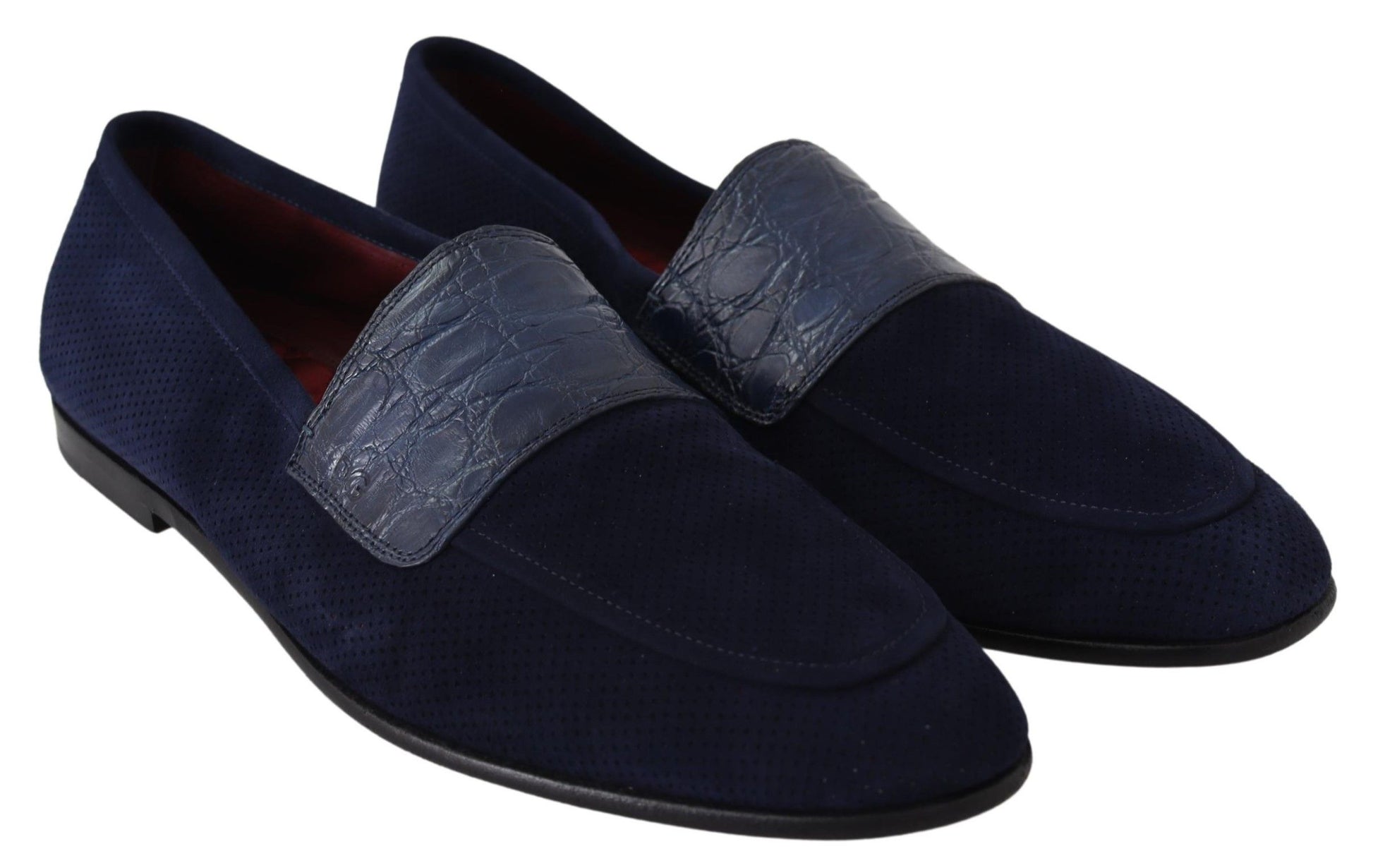 Pair of blue velvet loafers with elastic straps and a decorative band around the ankle