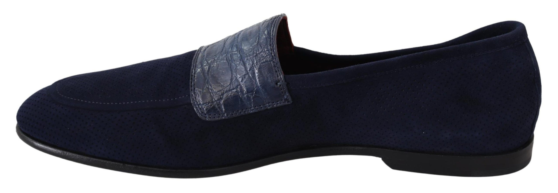 Pair of black loafers with a decorative strap across the top