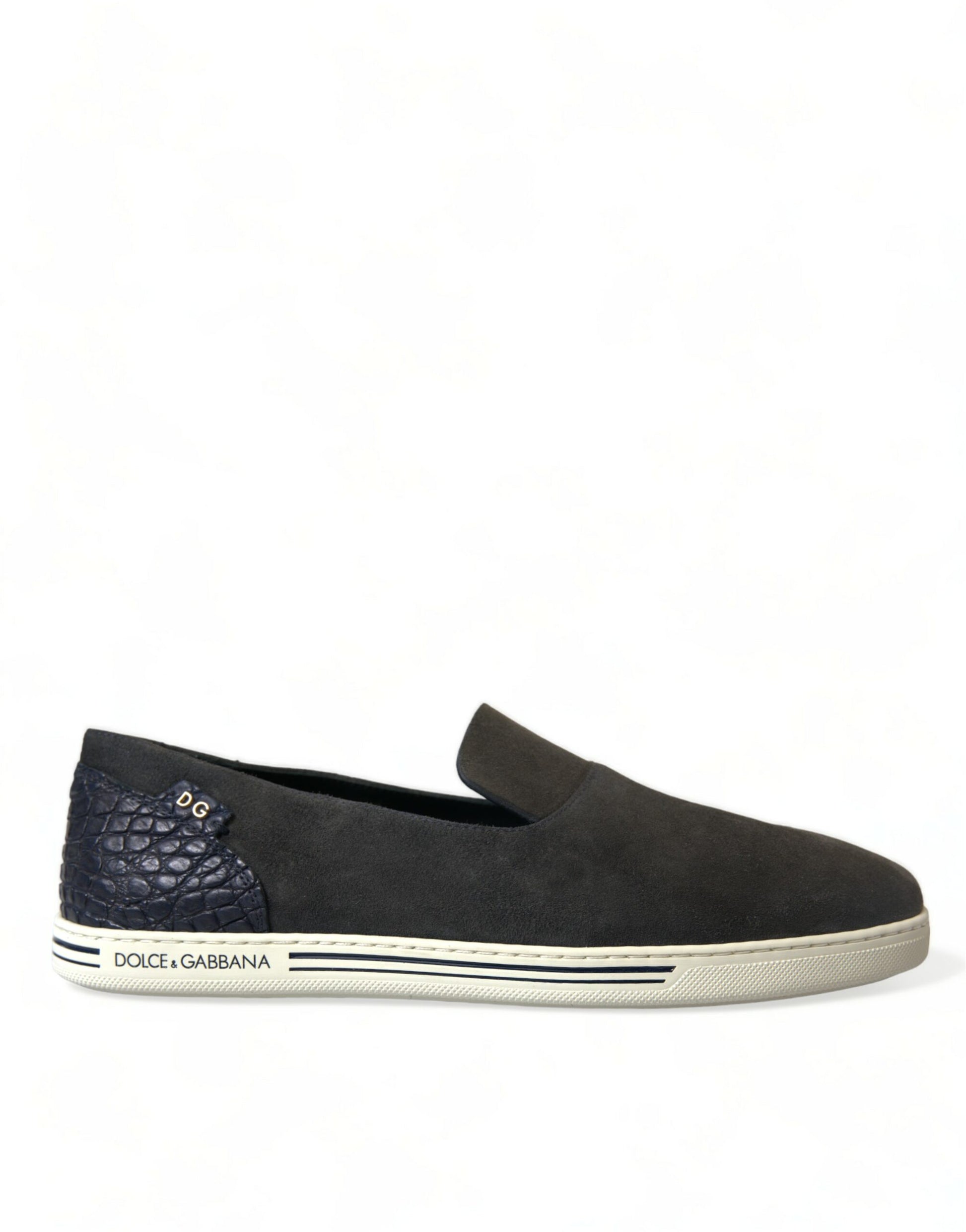 A single shoe against a white background. It is a slip-on style with a dark blue upper and a light blue sole. There are t