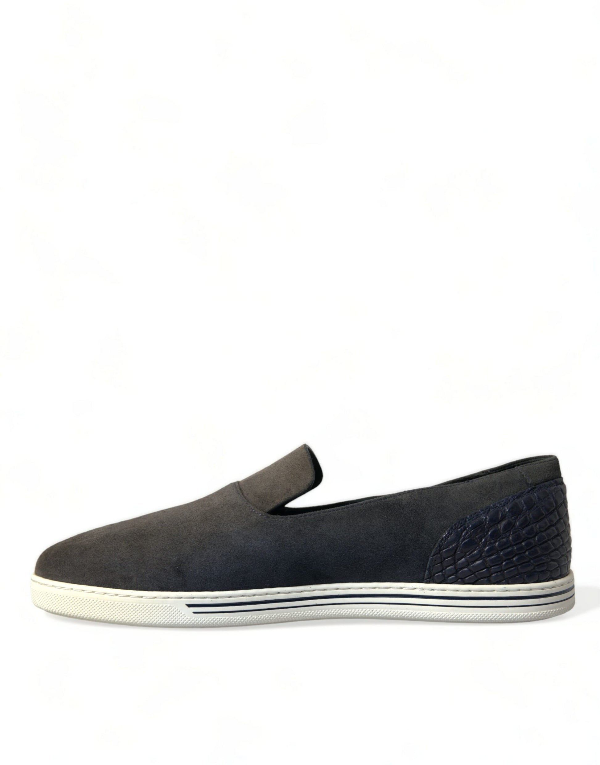 Pair of dark blue slip on shoes with white soles and laces