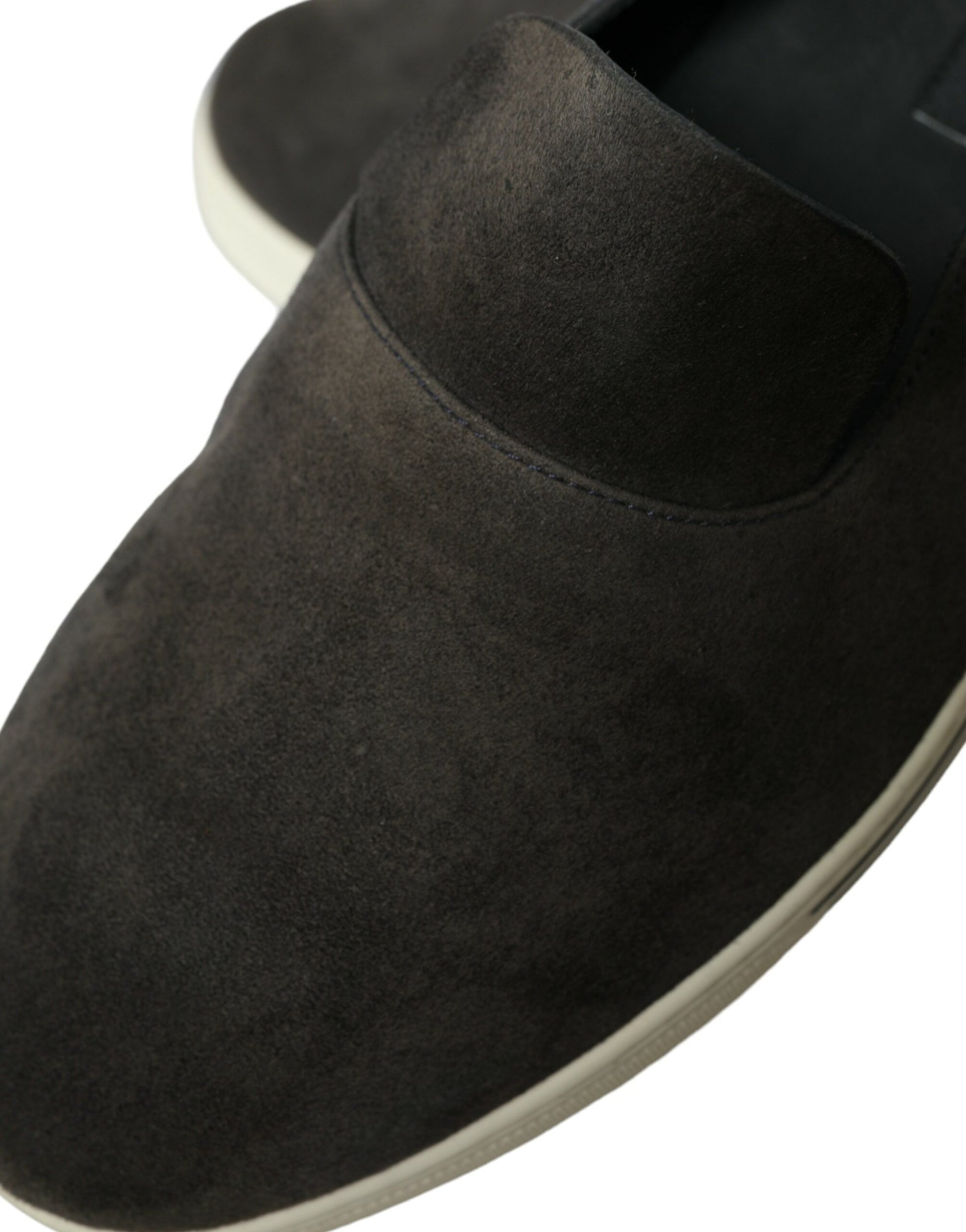 Pair of brown suede shoes with tan soles and laces