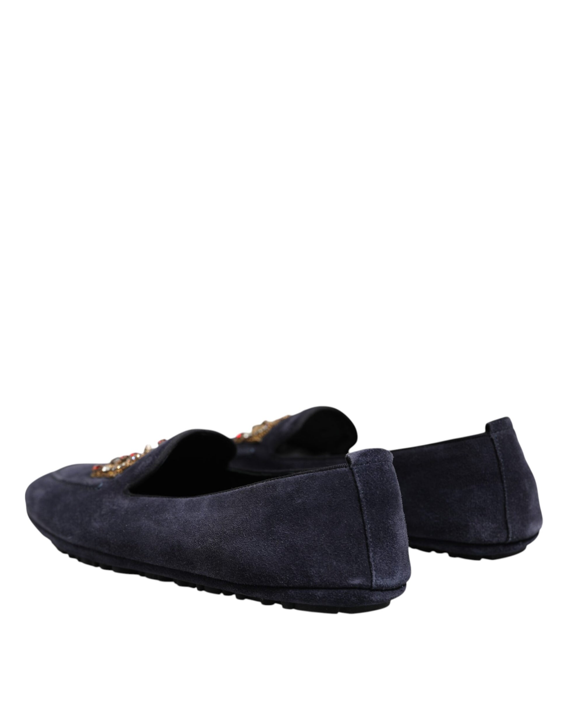 A pair of blue suede loafers with crystal embellishments, featuring a crown logo on the side