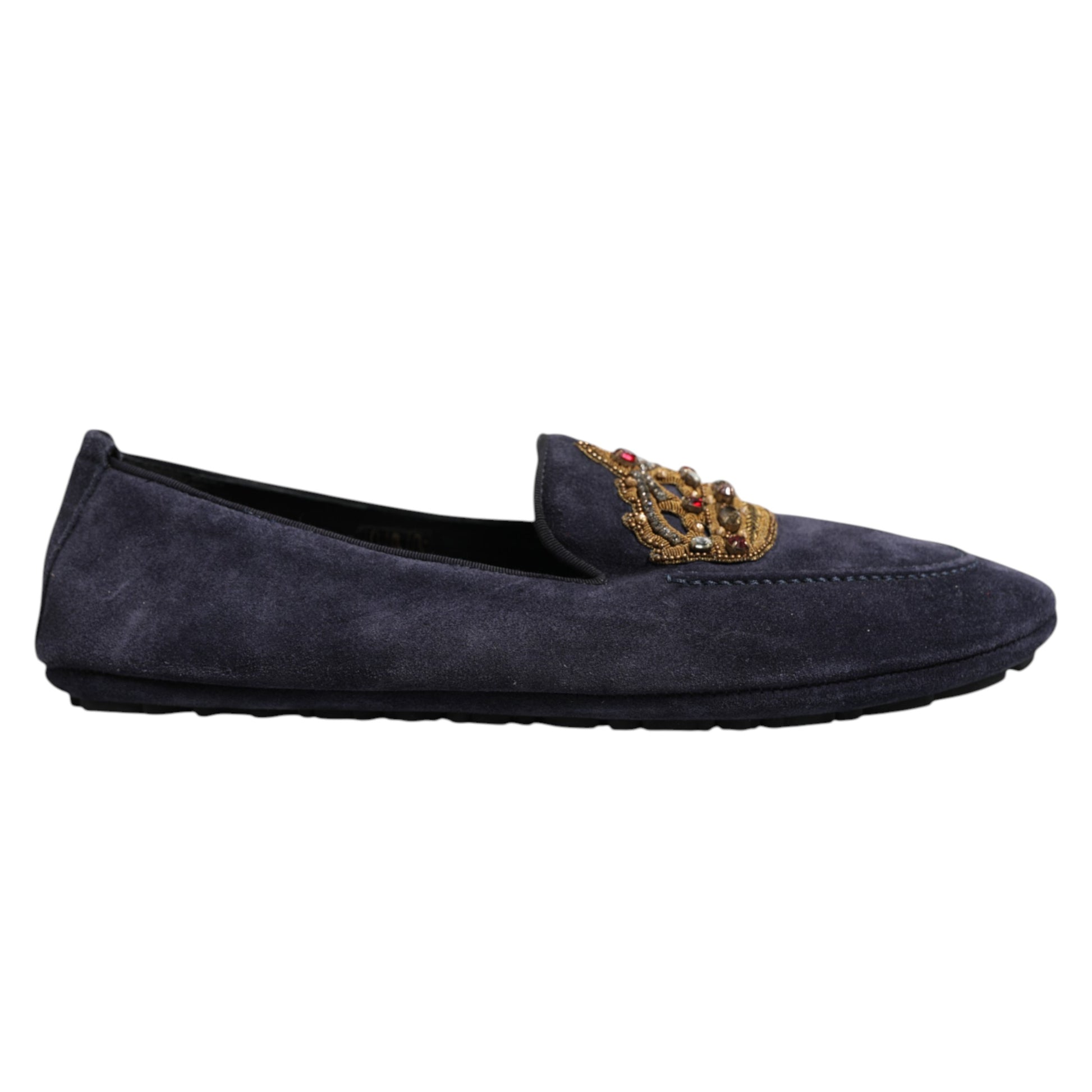 A pair of blue suede loafers with a gold crown embellishment on the toe