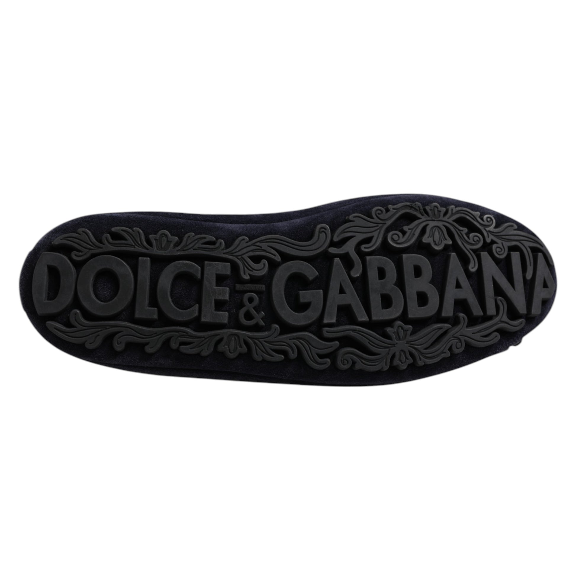 A pair of blue suede loafers with crystal embellishments from Dolce & Gabbana