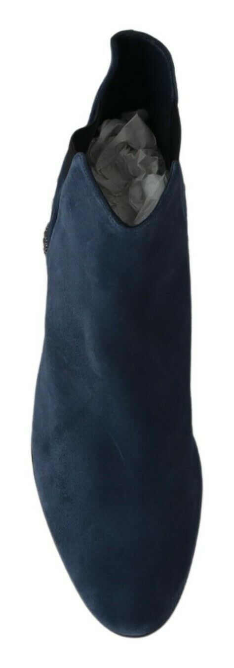 Pair of dark blue shoes with a pointed toe and a small heel