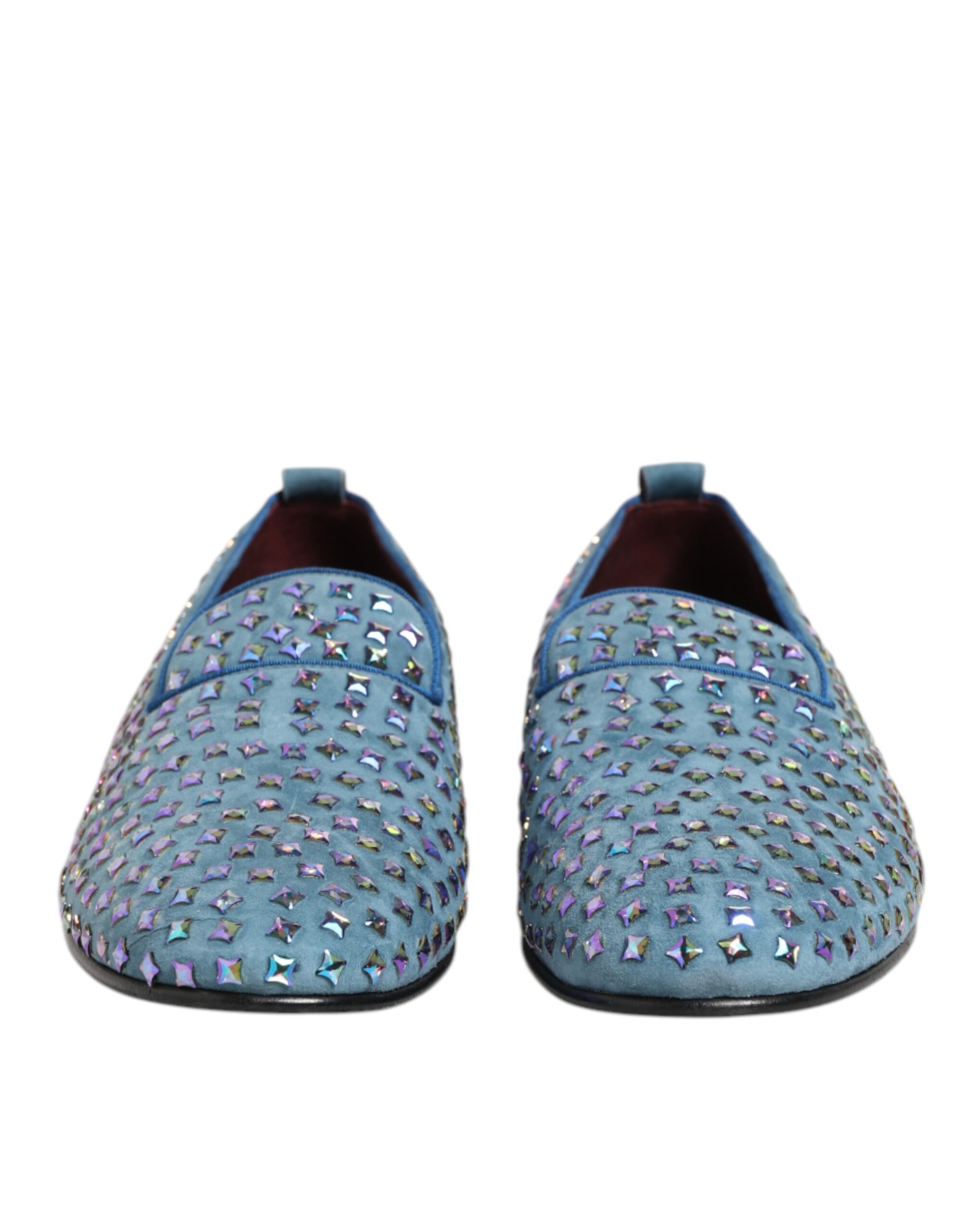 A pair of blue suede loafers with studs, designed by Dolce & Gabbana