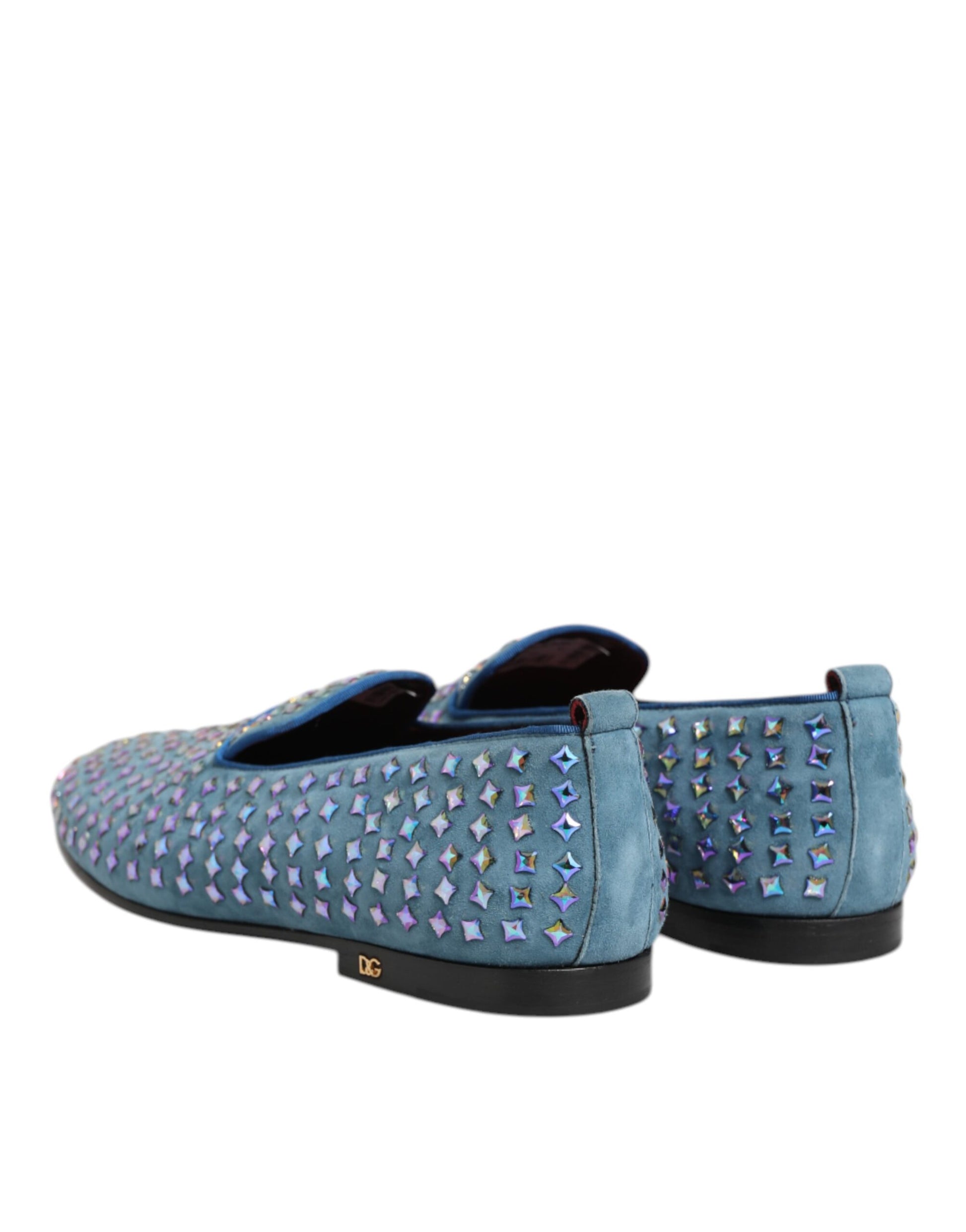 A pair of blue suede loafers with studs, designed by Dolce & Gabbana