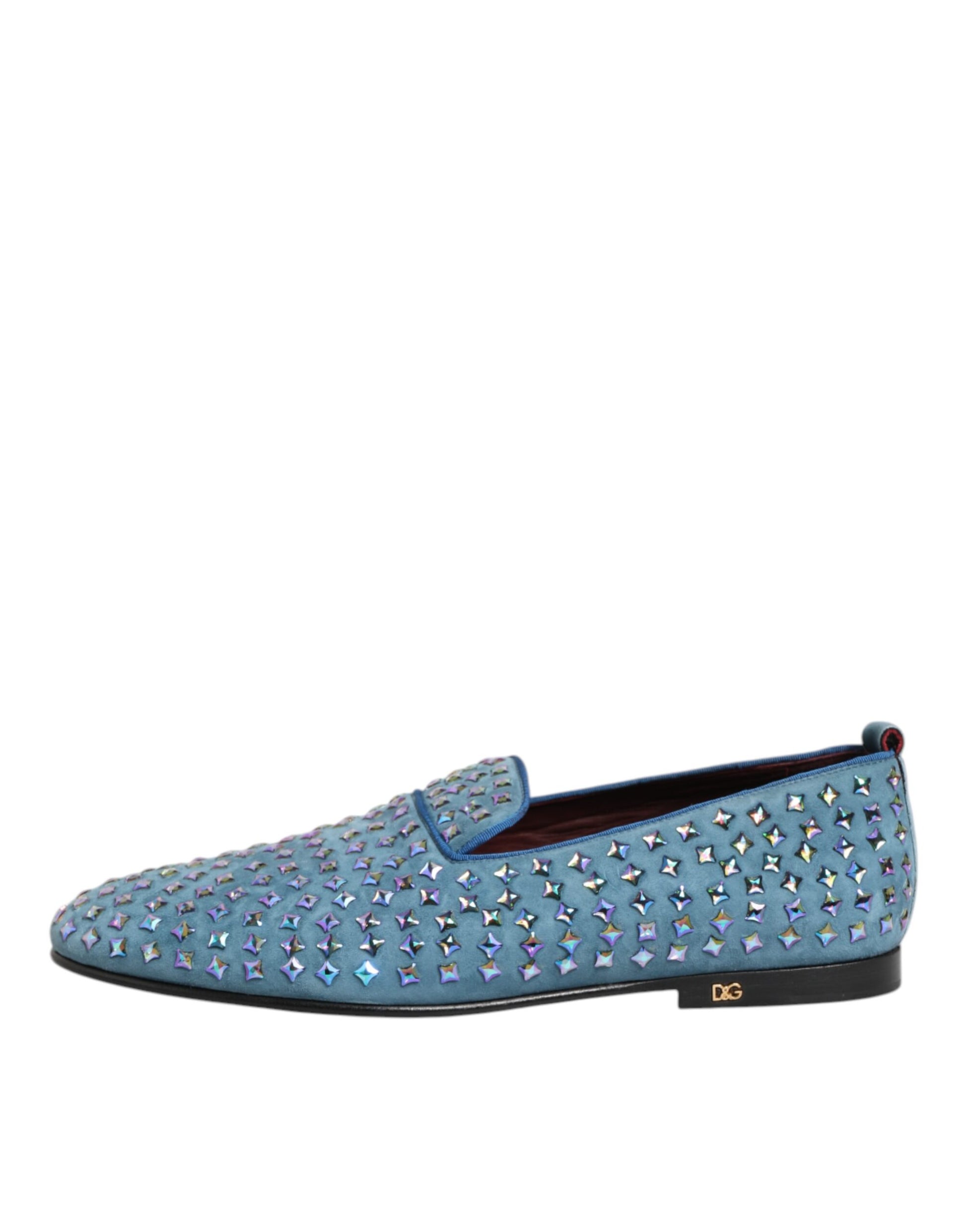 A pair of blue suede loafers with studs, featuring a logo on the side