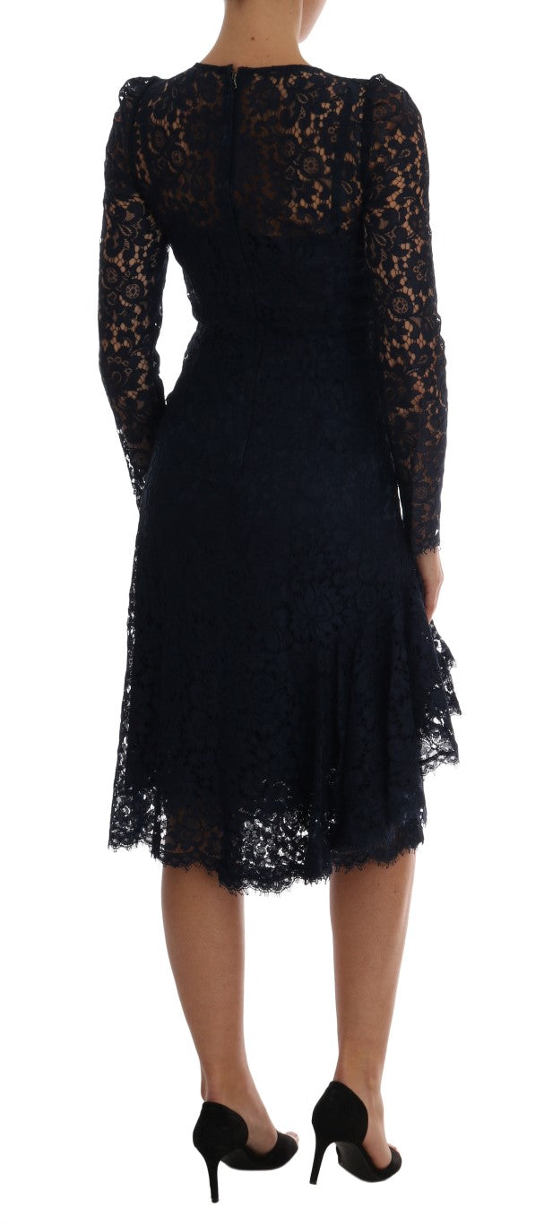 A long black lace dress with floral pattern on a mannequin