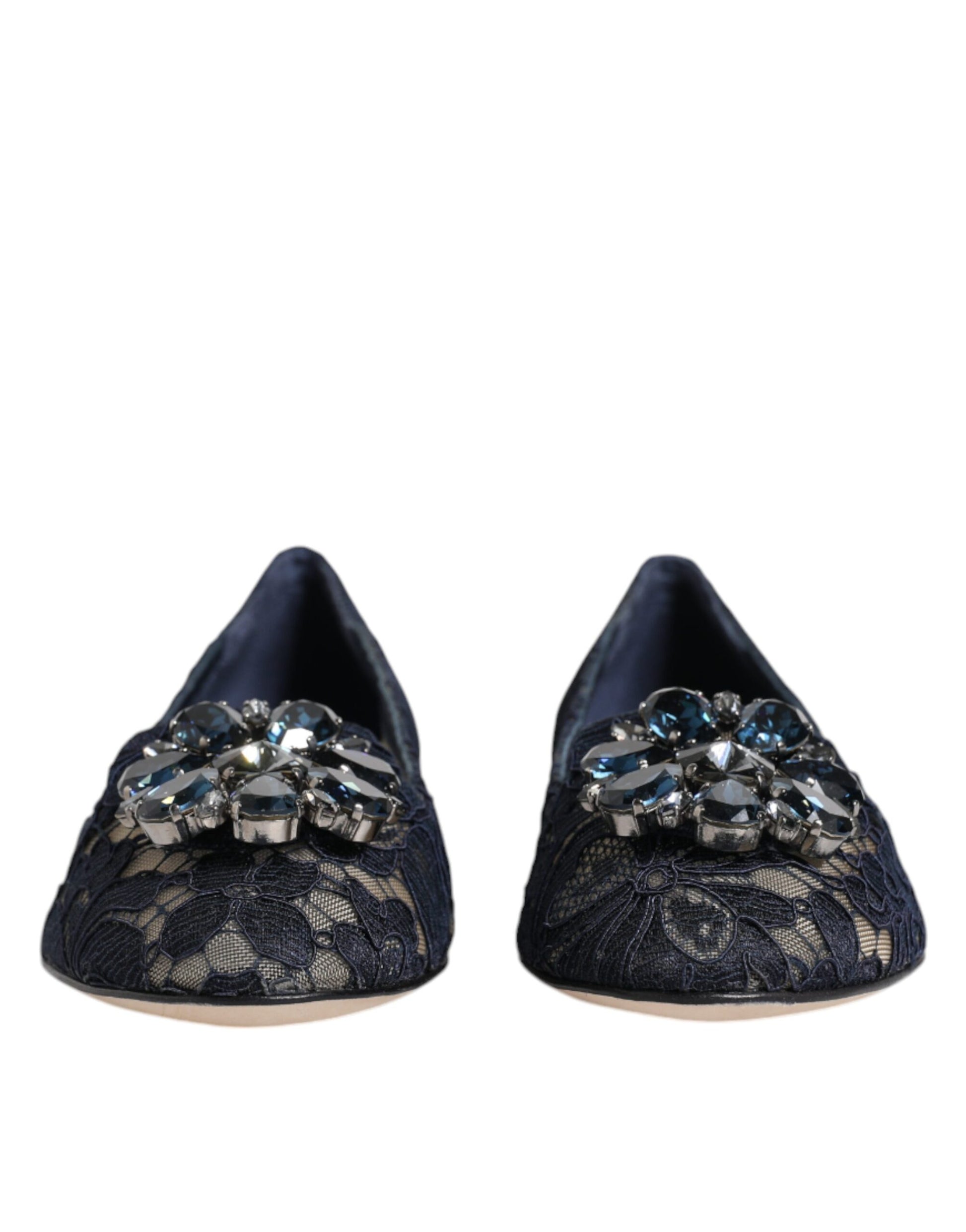 Pair of black shoes with embellishments on top