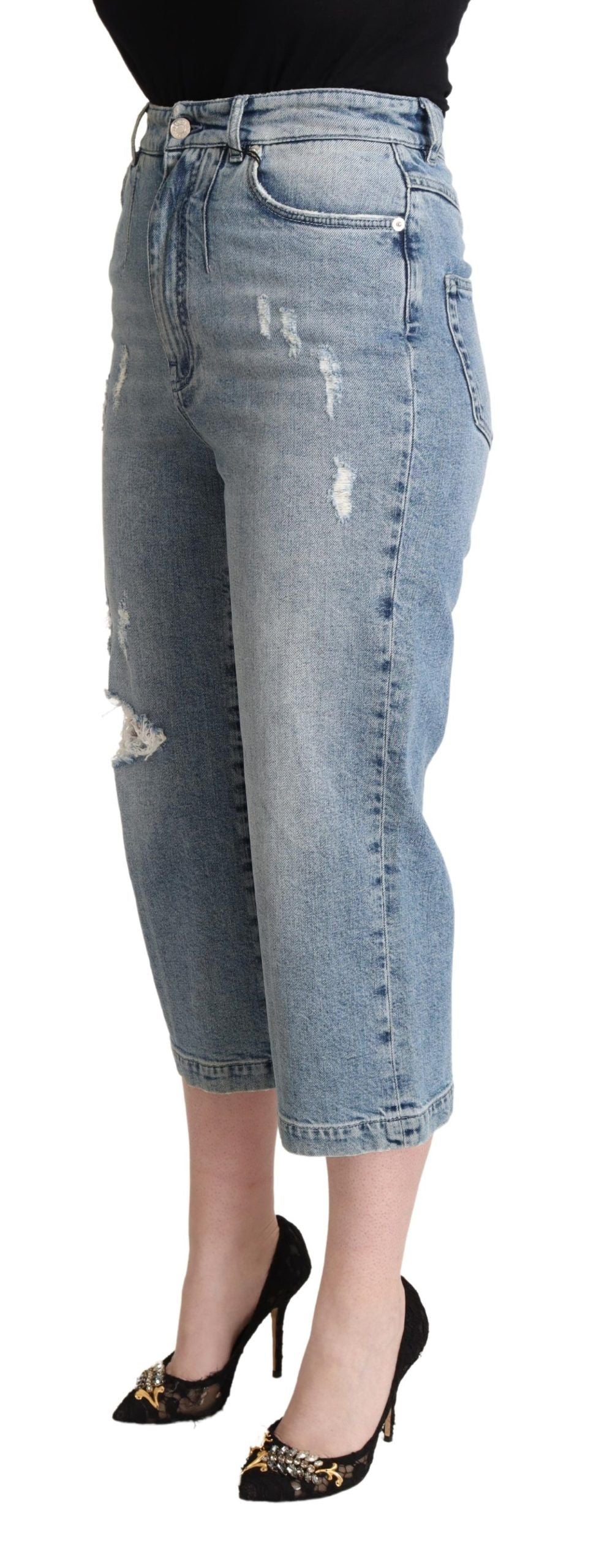 Pair of blue denim jeans with distressed details