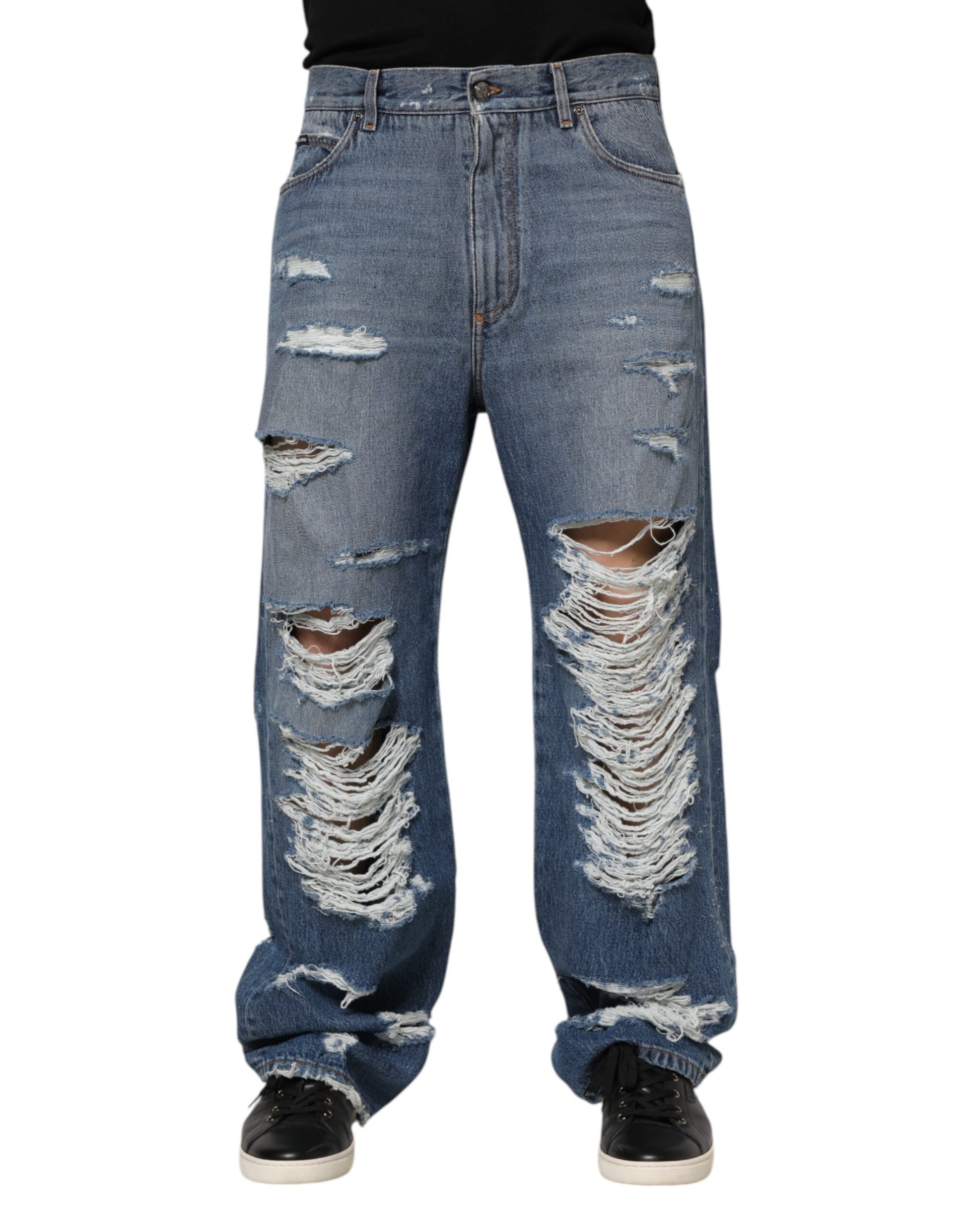 Pair of distressed blue jeans with rips and tears