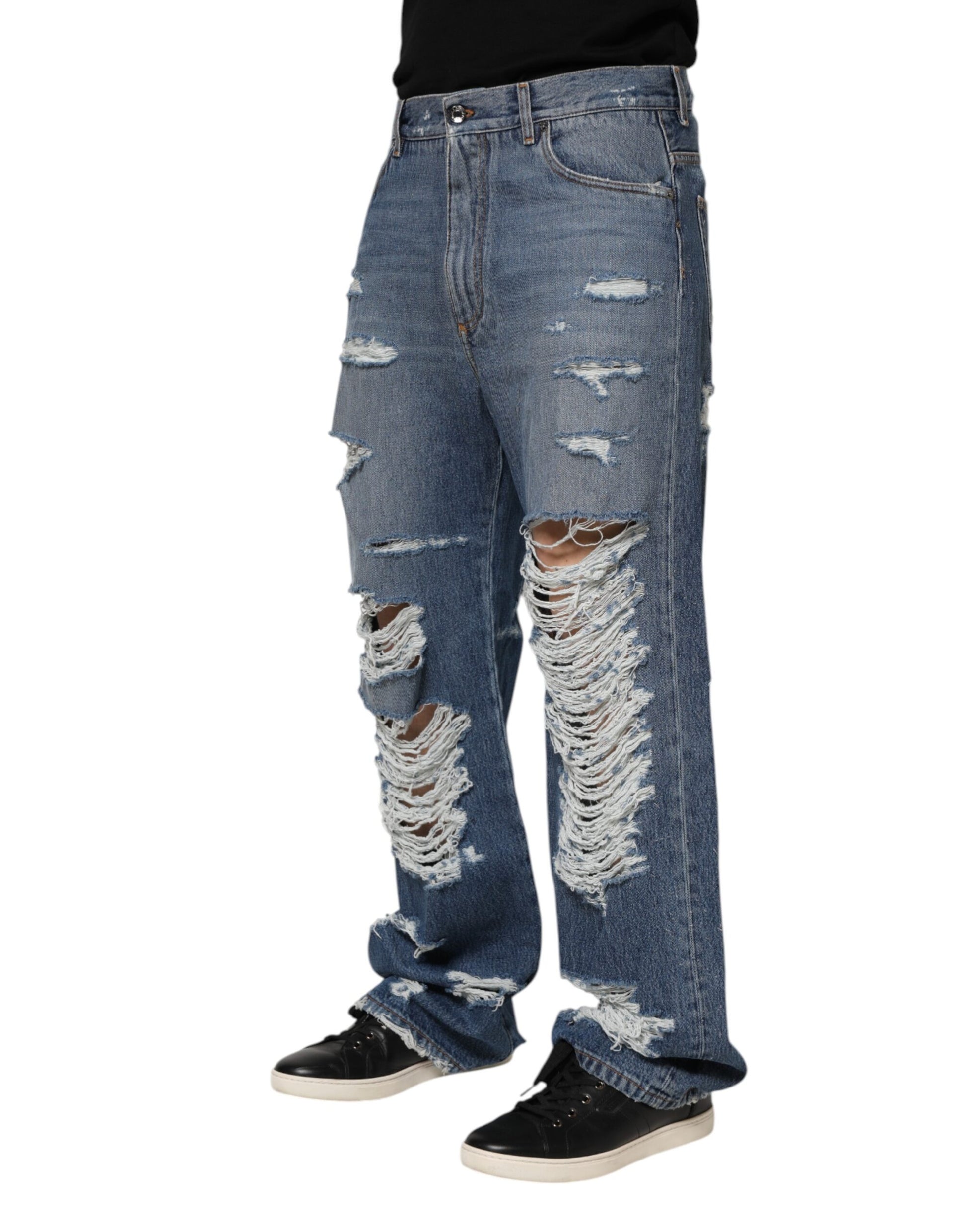 Pair of distressed blue jeans with holes in knees