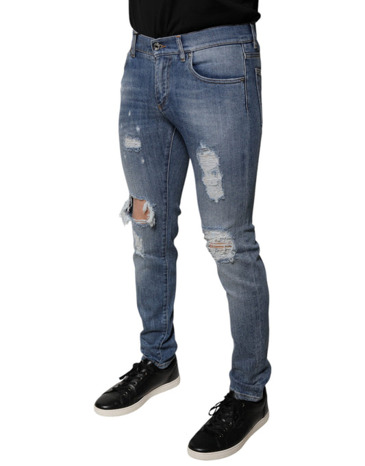 Man wearing blue jeans with holes and rips