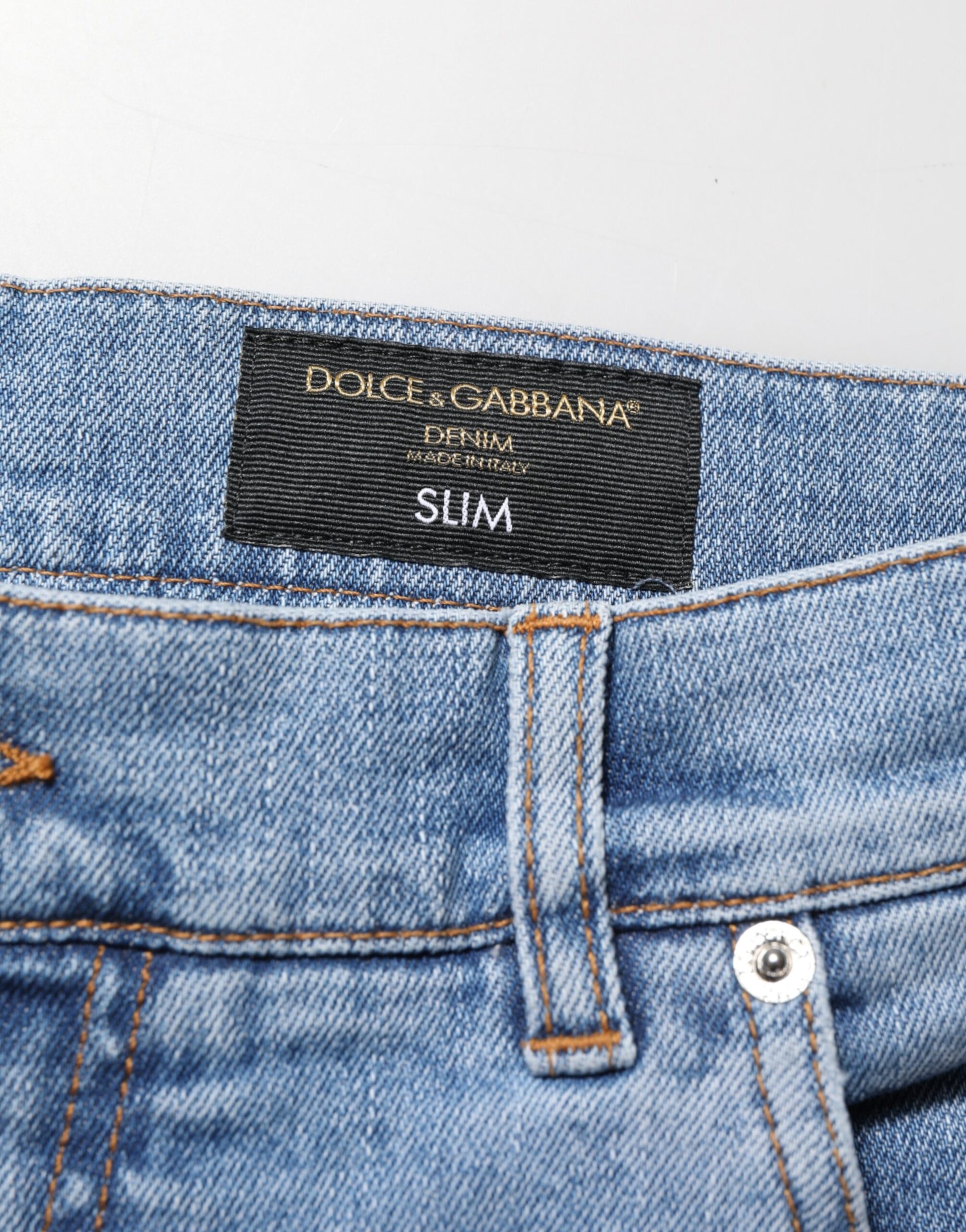 Blue denim jeans with brand label on waistband