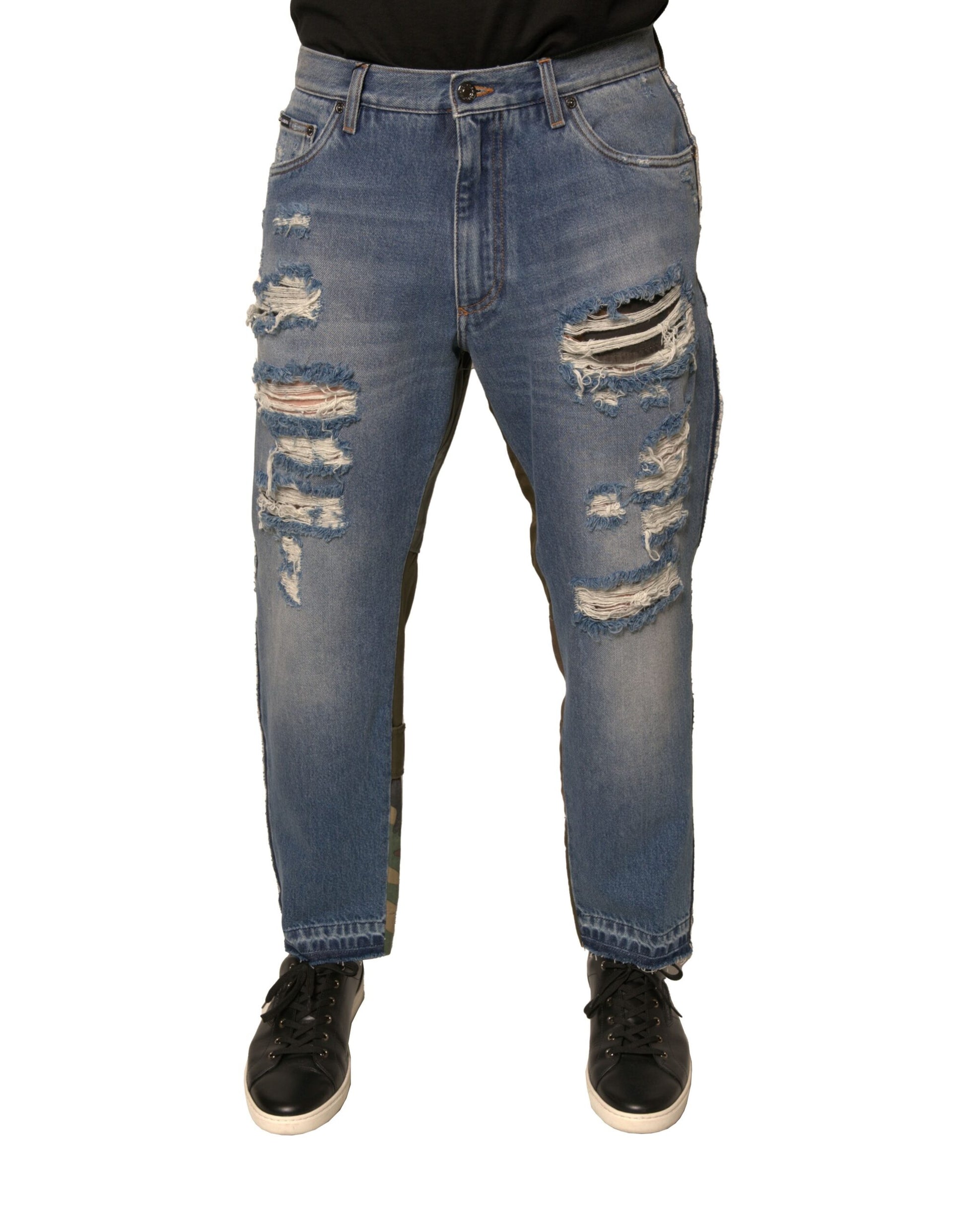 Pair of distressed blue jeans with holes and rips