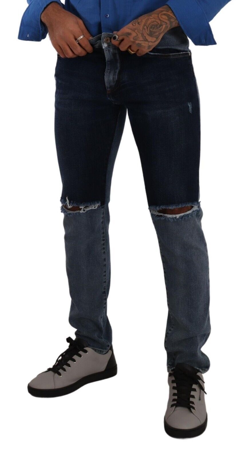 Man wearing blue jeans and sneakers