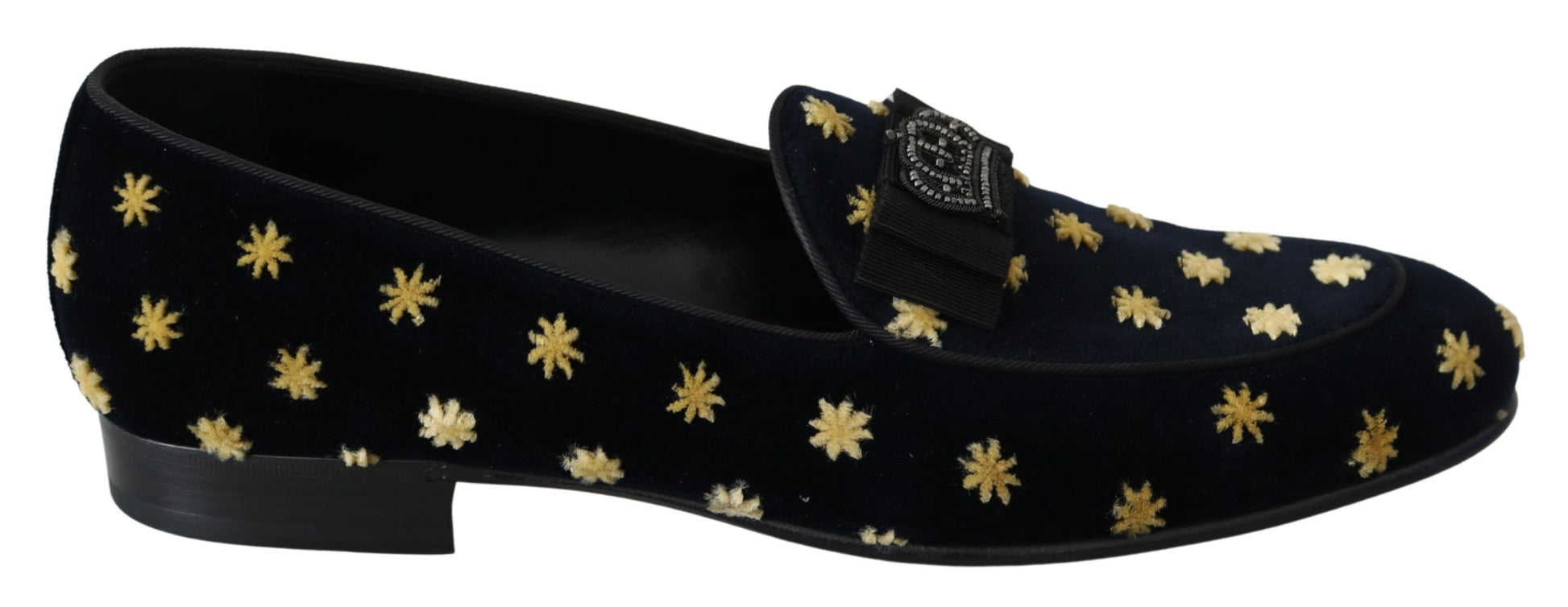 Pair of black velvet loafers with gold star pattern and bow detail