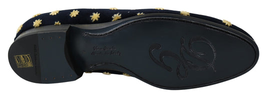 Pair of black shoes with gold stars on top