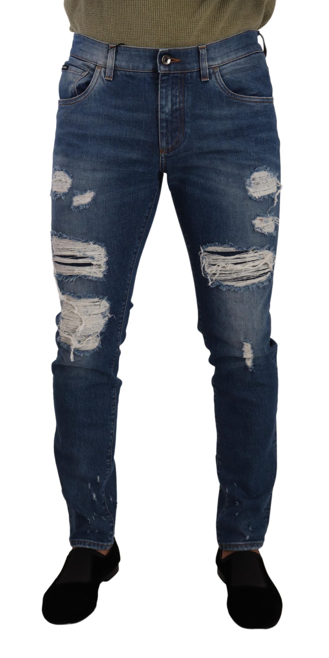 Pair of distressed blue jeans with holes and rips